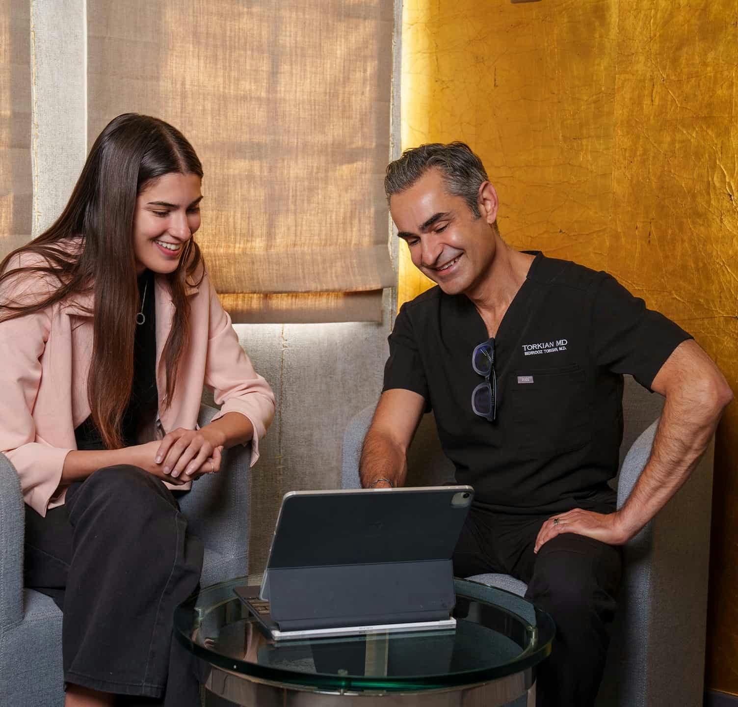 Dr. Torkian speaking to patient