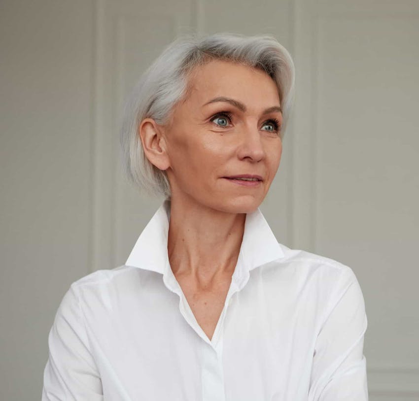 Woman wearing a white button down shirt