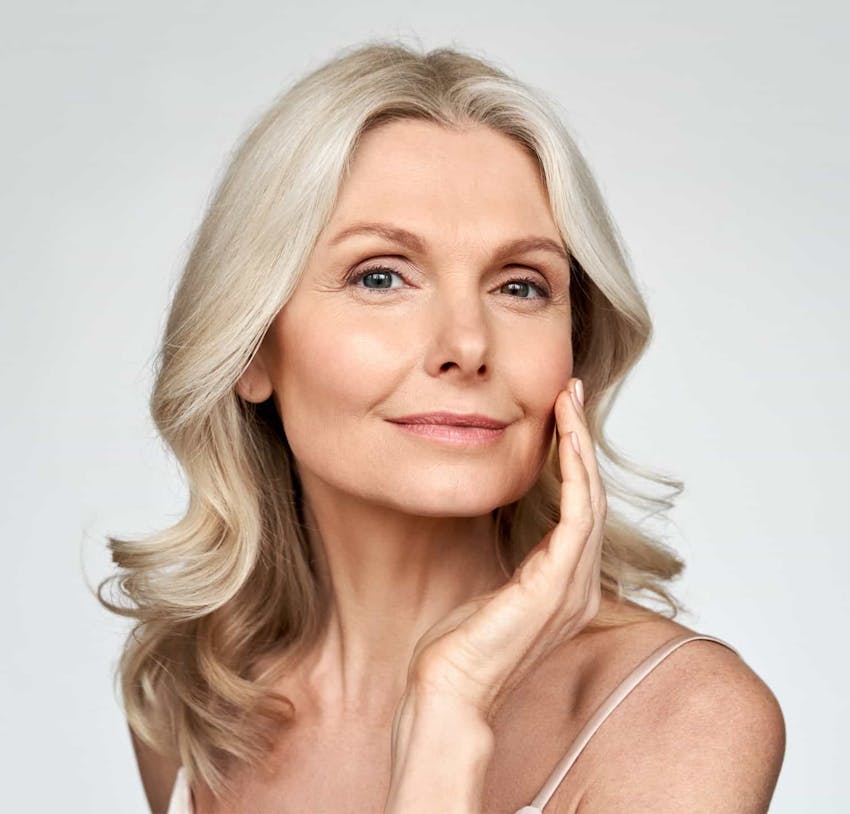 woman with curly grey/blonde hair