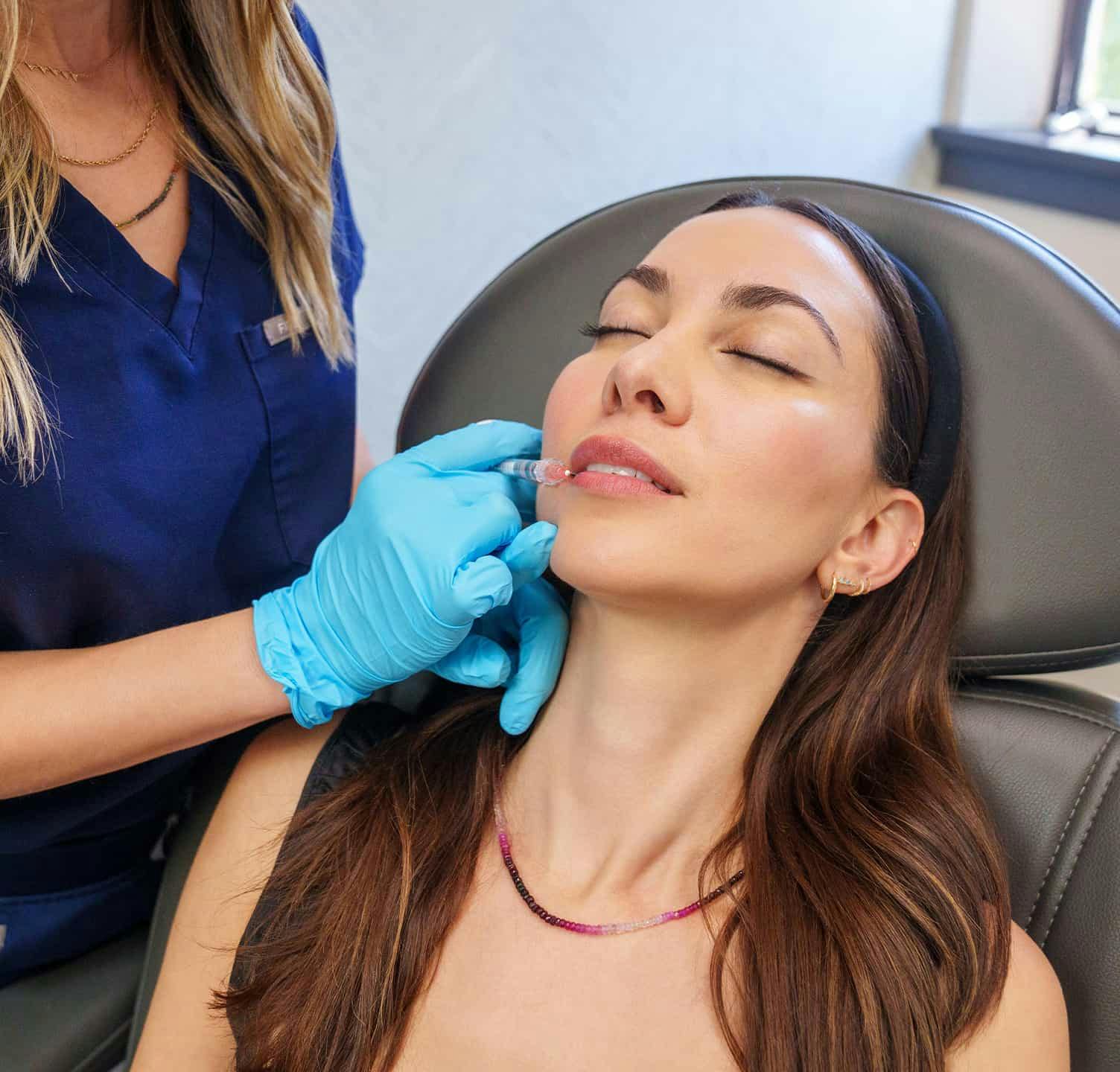 Woman receiving injectable treatment