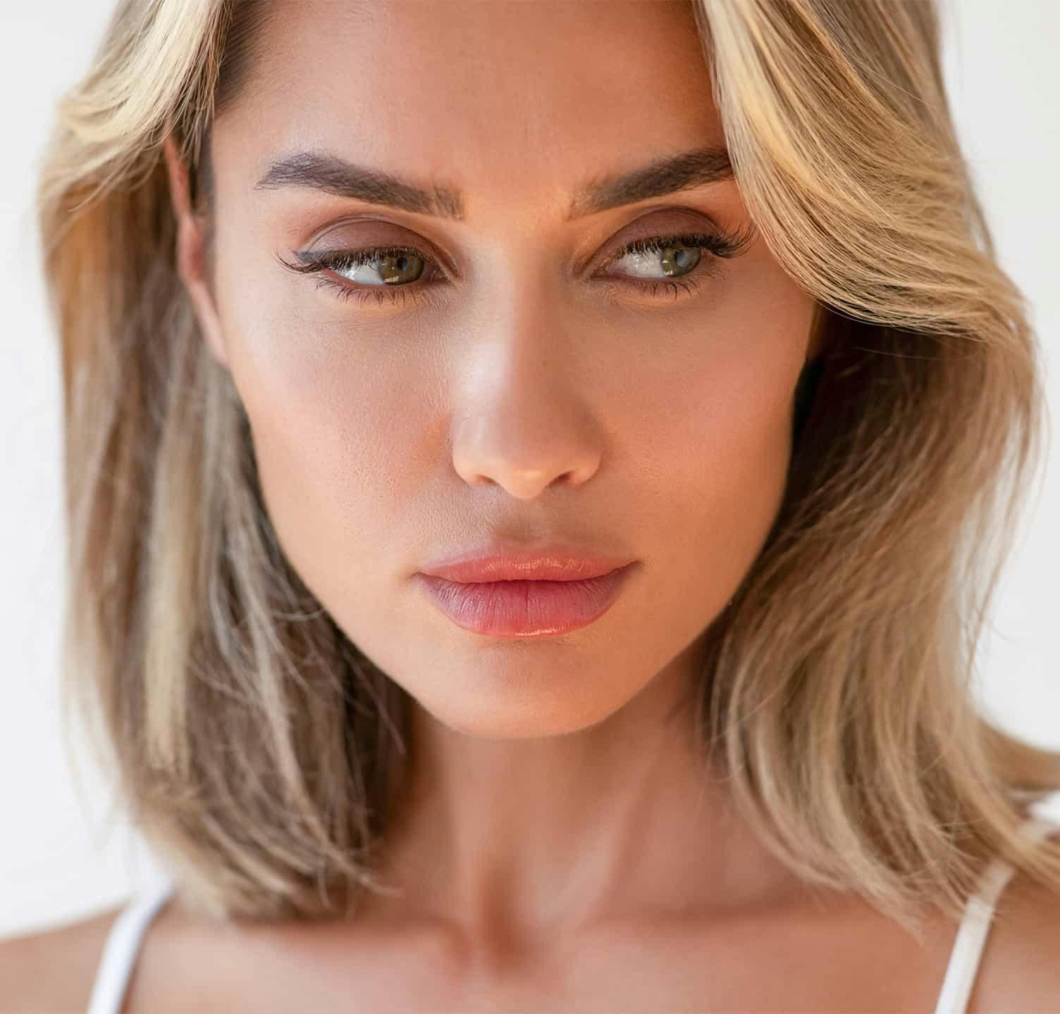 Blonde woman looking towards the side