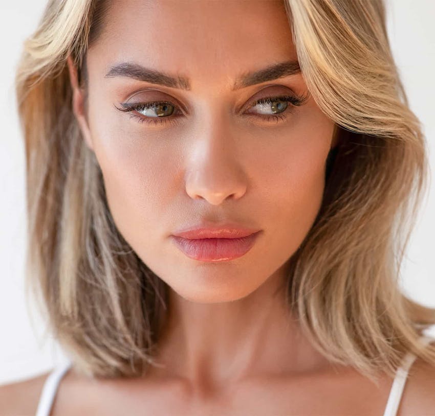 Blonde woman looking towards the side