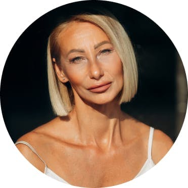 Blond woman with her head tilted