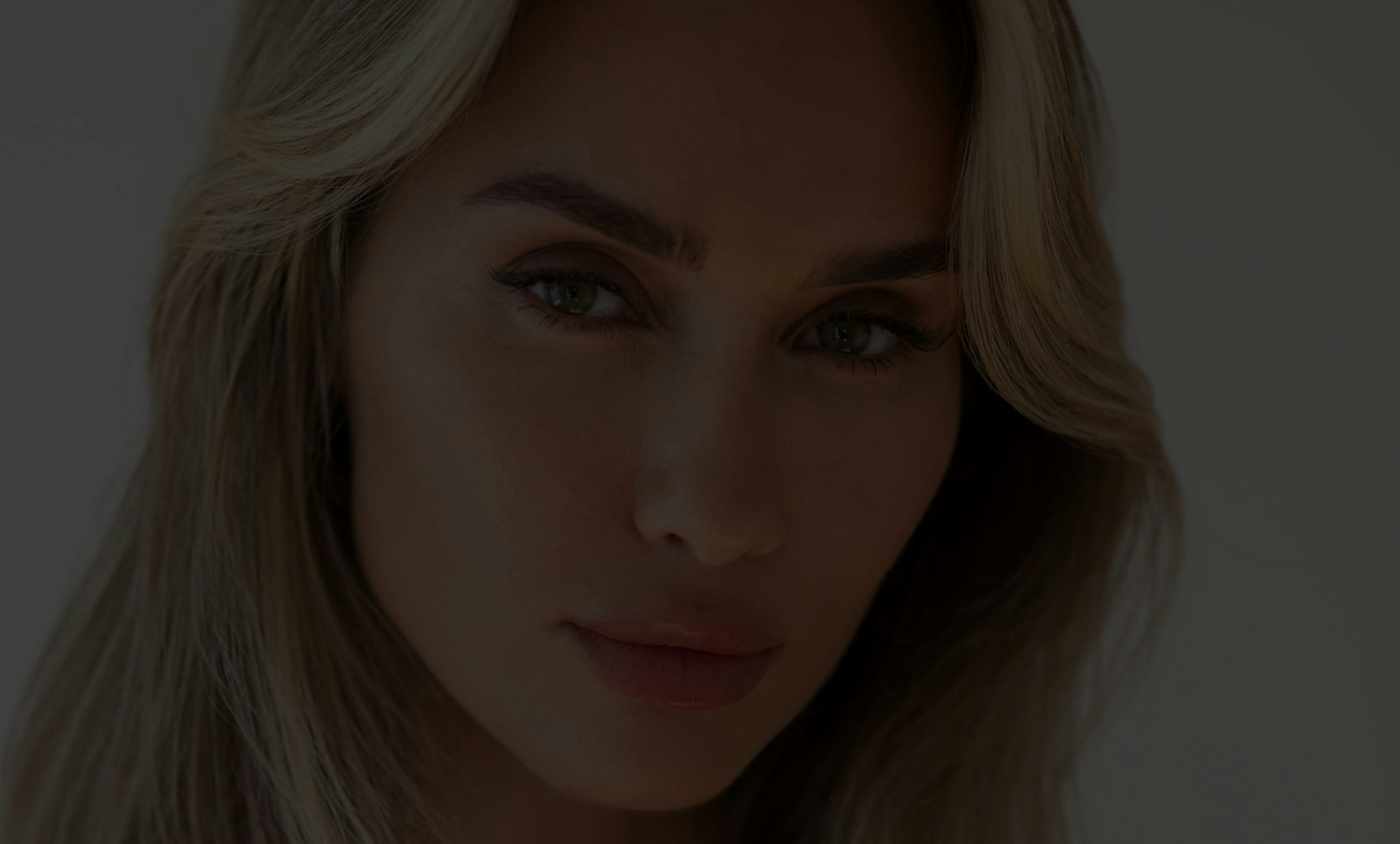 Dark image of a blond woman