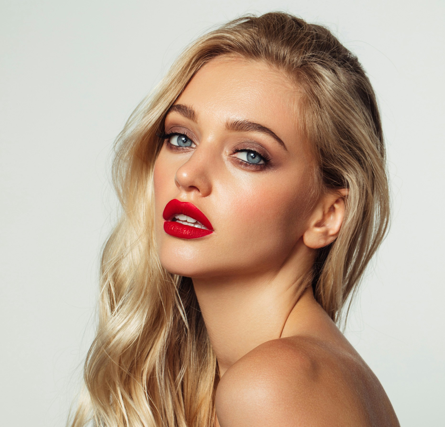 Young woman poses for the camera showing off the potential results of a rhinoplasty in Beverly Hills with Dr. Torkian