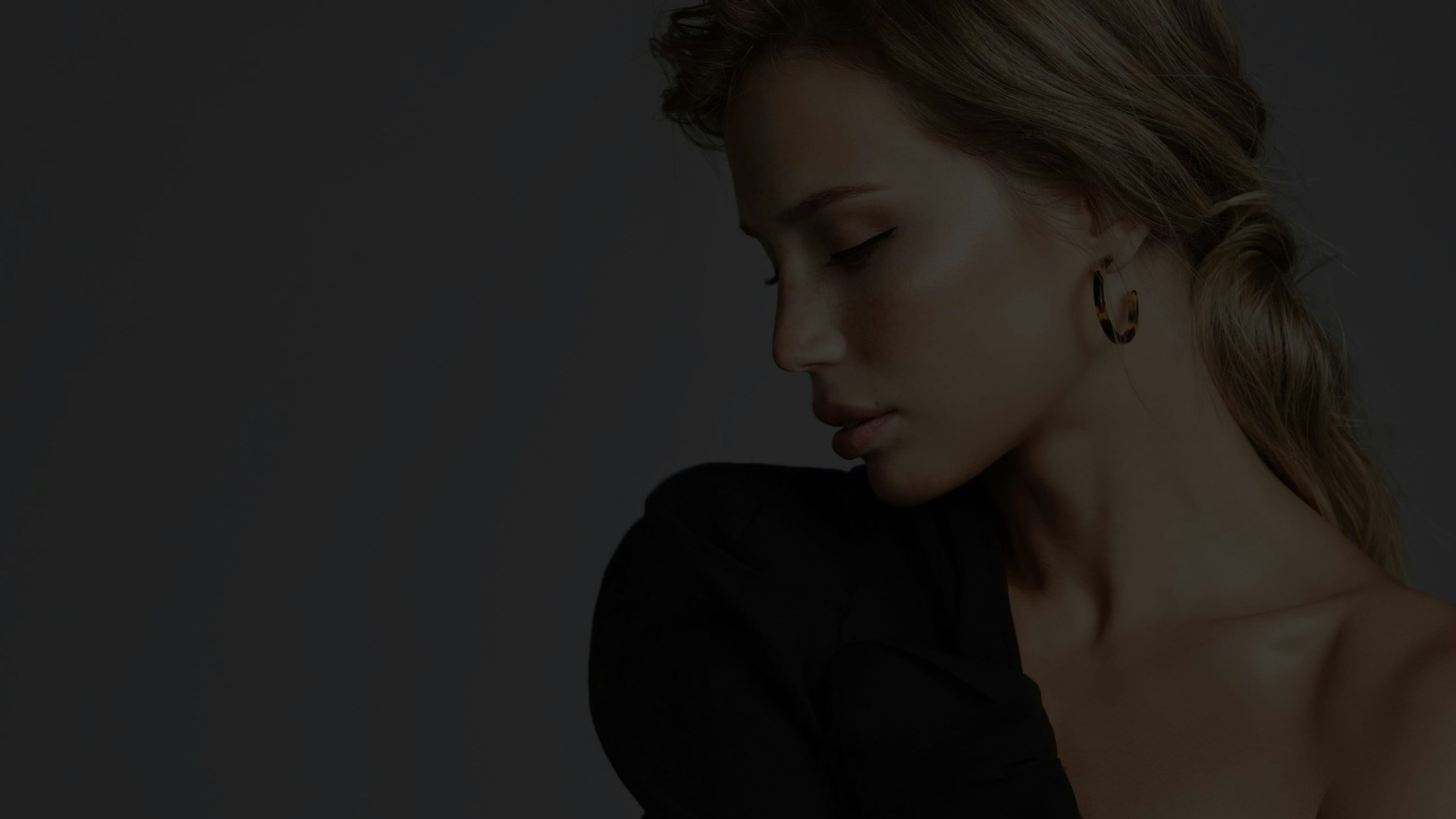 Dark image of woman in blue lace