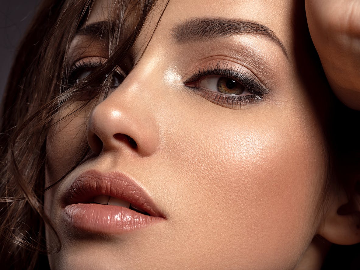 Woman showing profile to the camera in a studio shoot. The profile of her nose is perfectly straight emulating the potential resutls of a nose job in Beverly Hills with Dr. Torkian