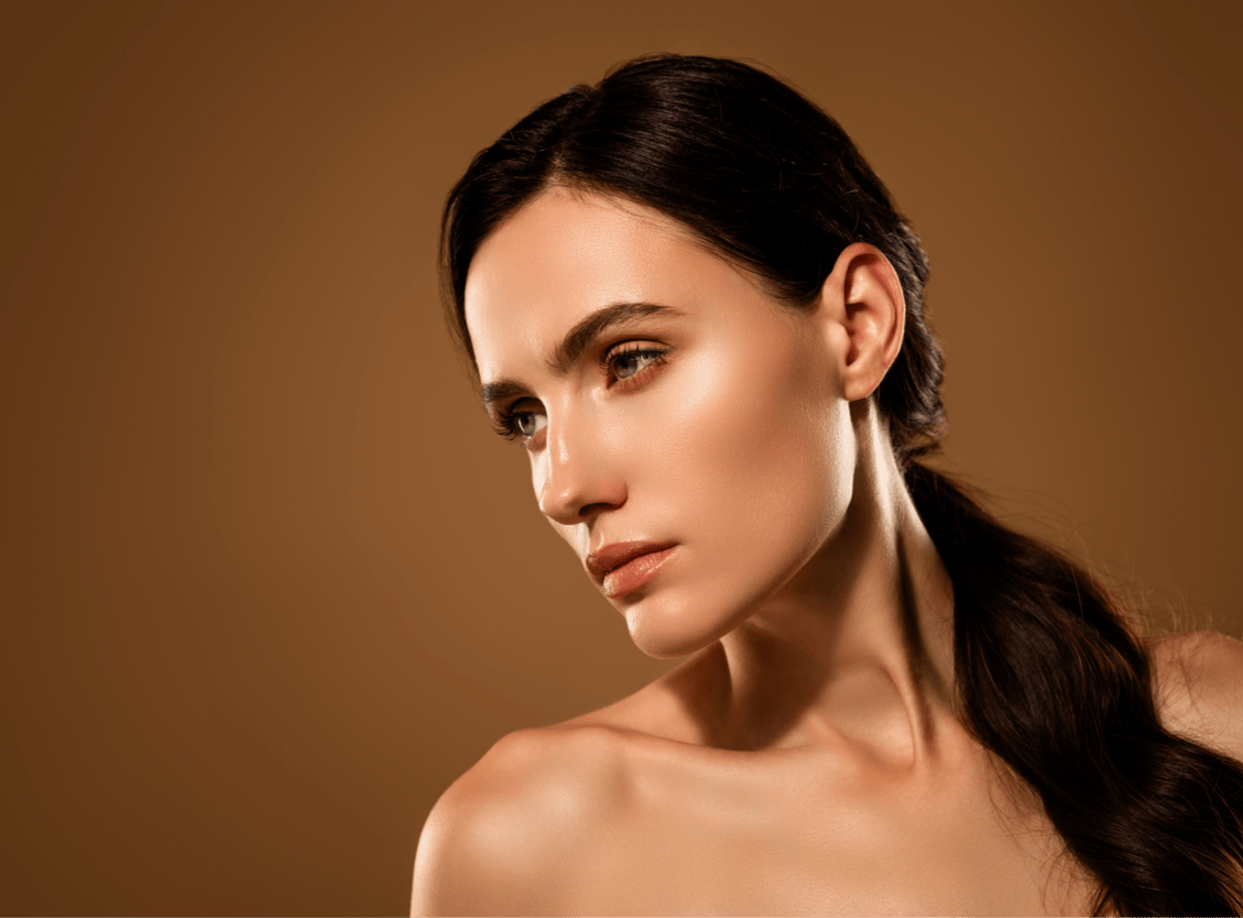 woman in studio shoot with hair tied back in a low pony tail shoes off the profile of her nose to emulate the possible results of a Beverly Hills Revision Rhinoplasty with Dr. Torkian.