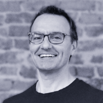 Andrew Trader ("AT")