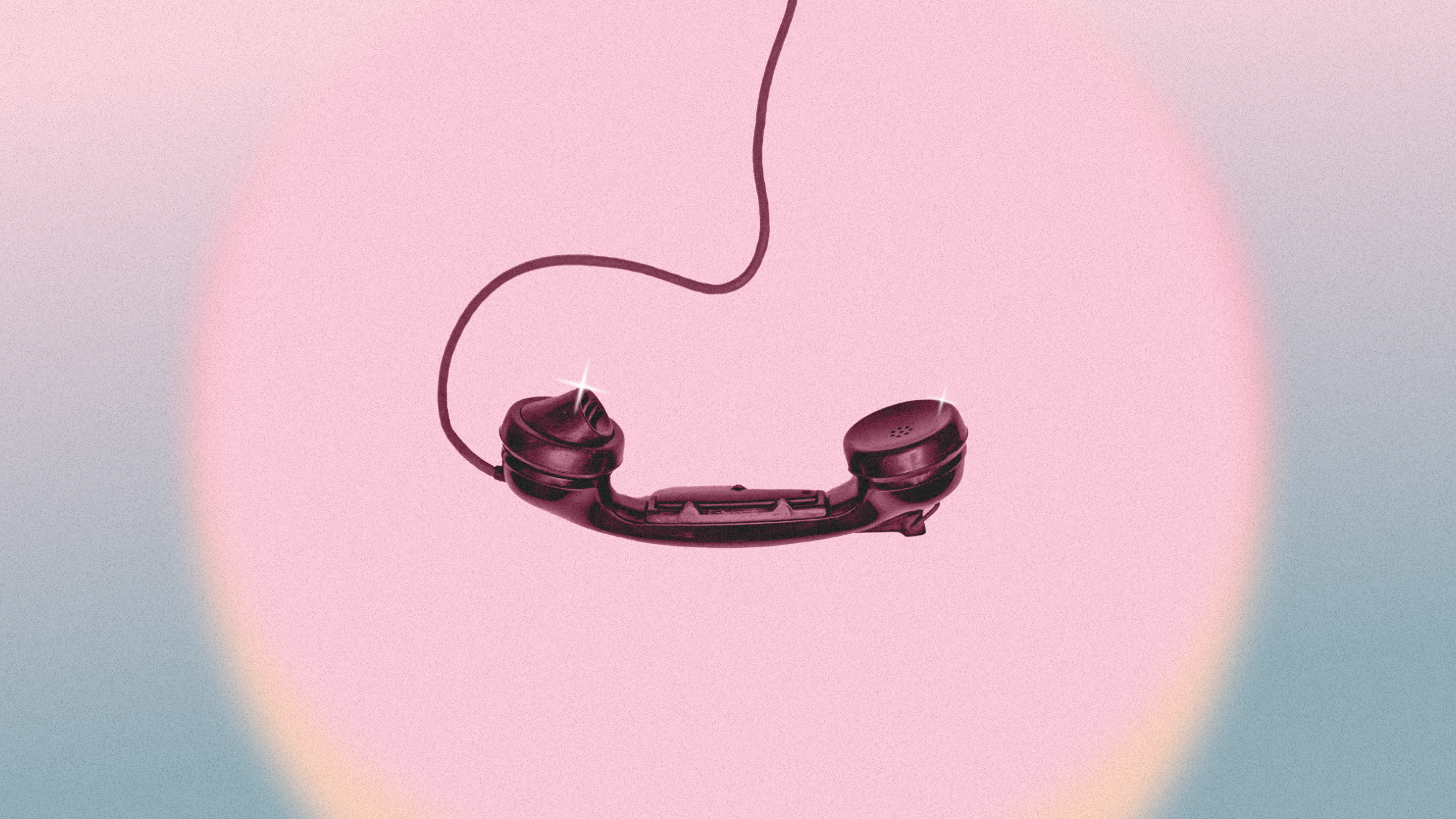 A black analog telephone in a pink and blue spotlight A black analog telephone in a pink and blue spotlight