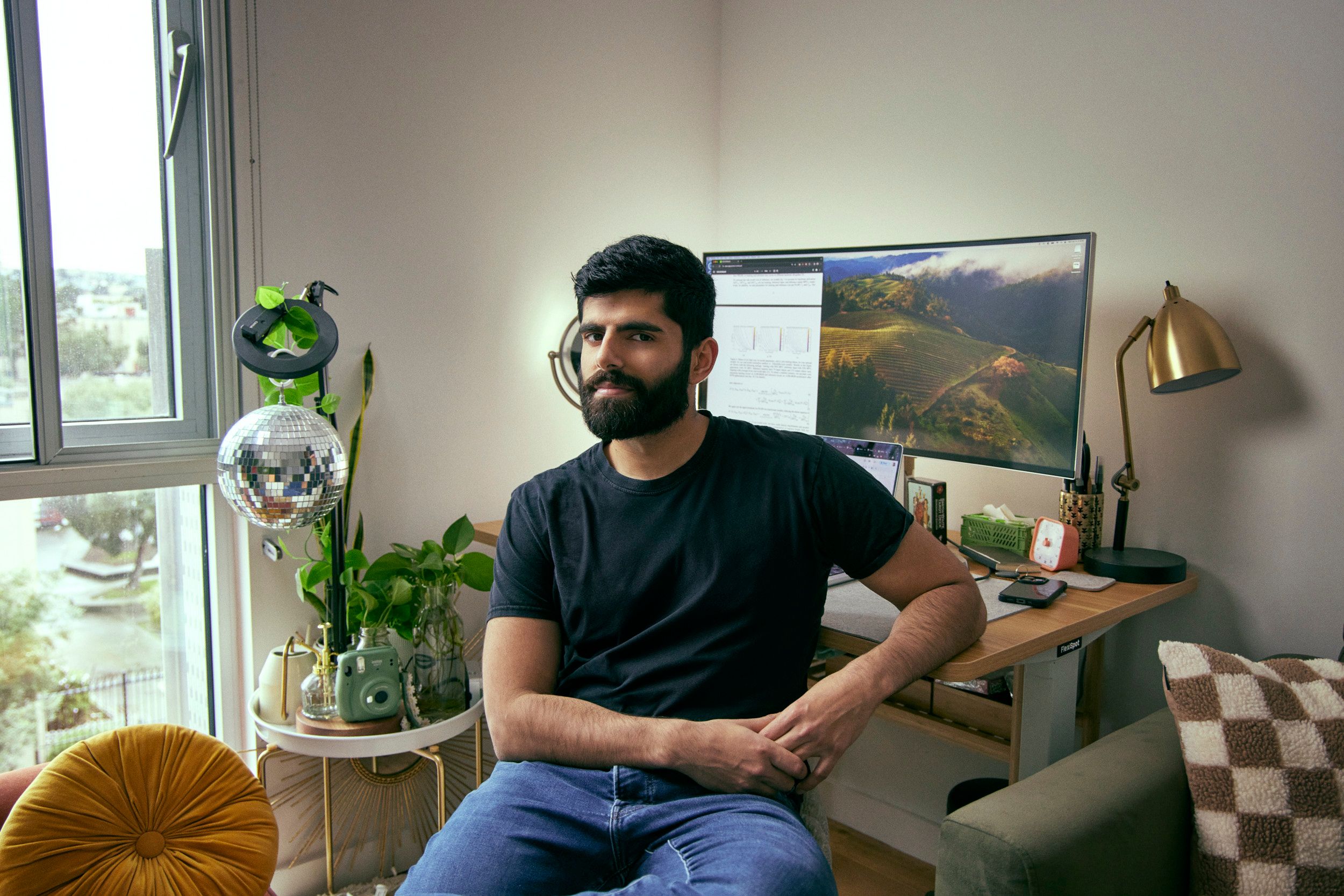 Photo of Patel at computer
