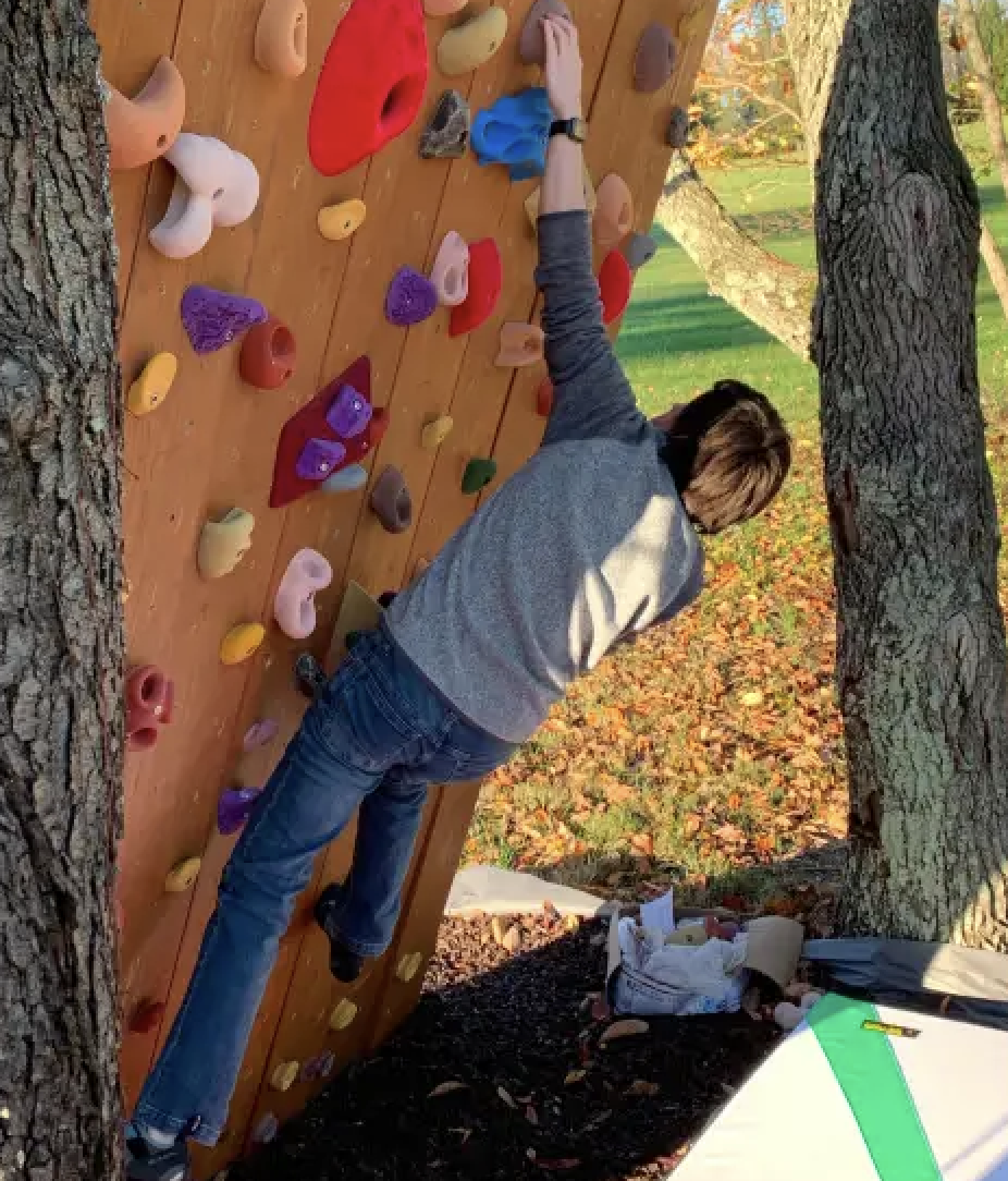 David on a rock climbing wall