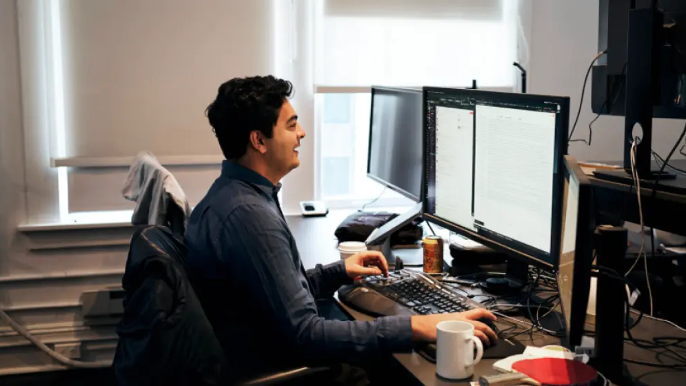 Immad working at a desktop