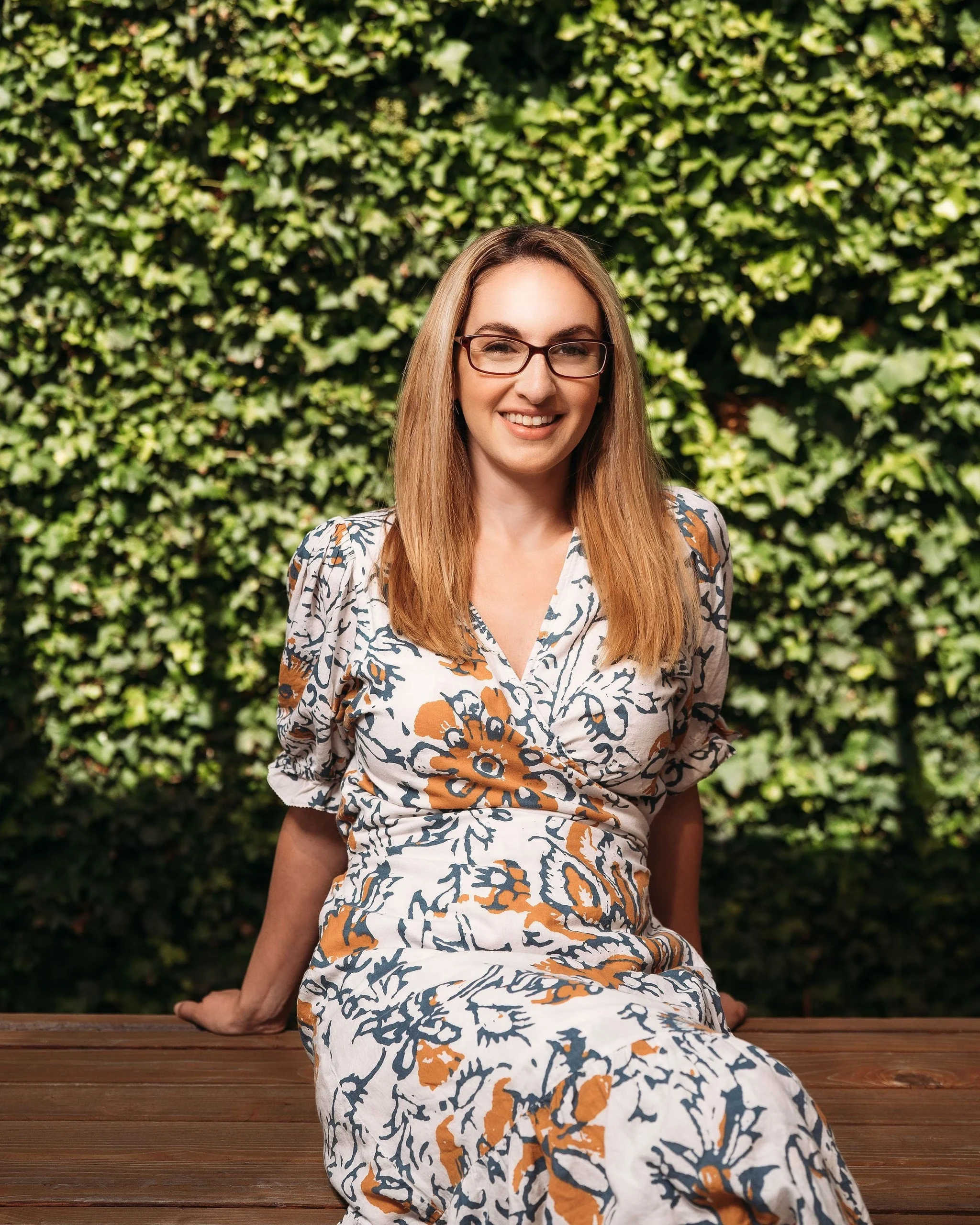 Portrait of Sara Mauskopf sitting outside