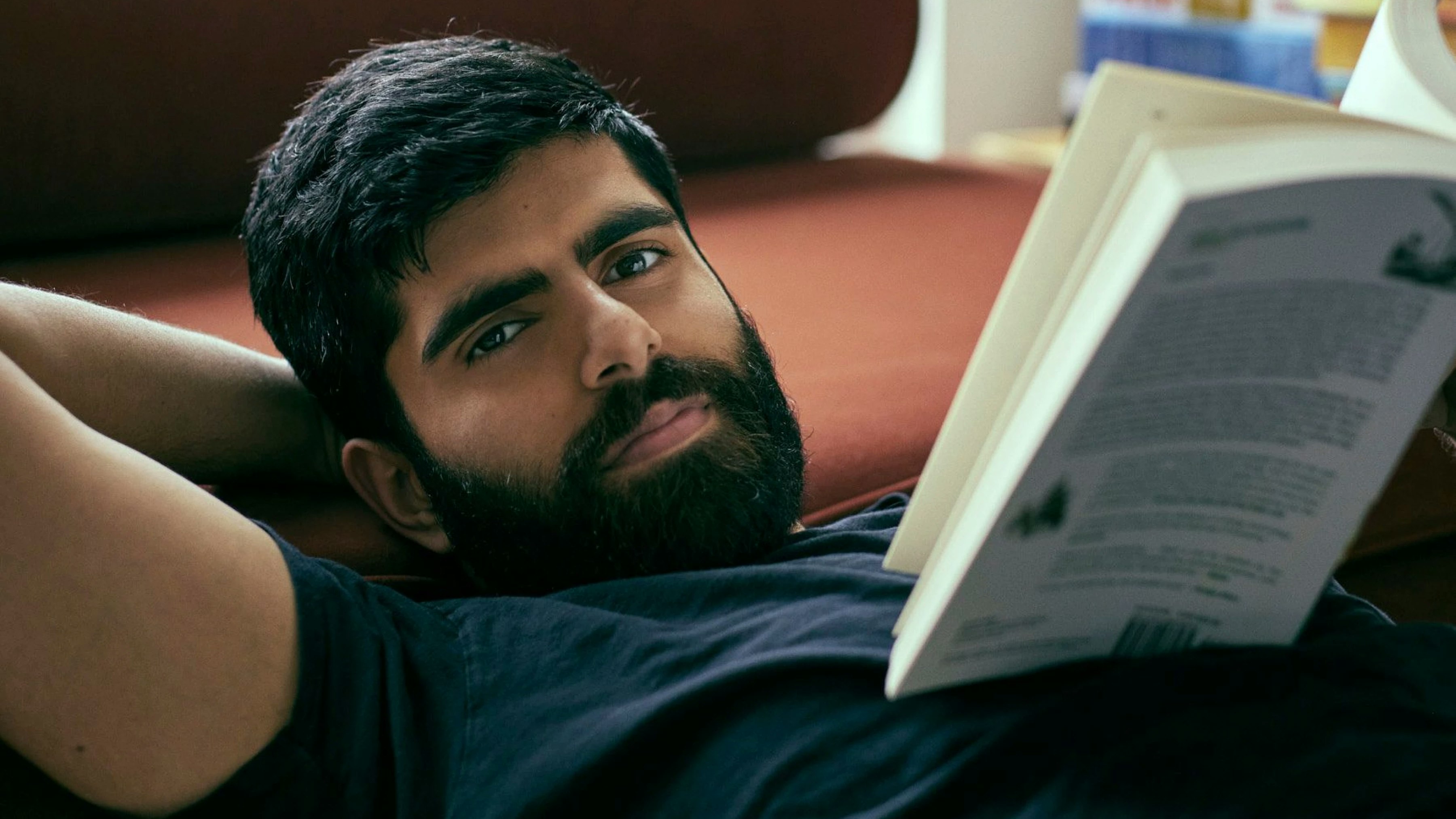 Photography of Dwarkesh Patel reading