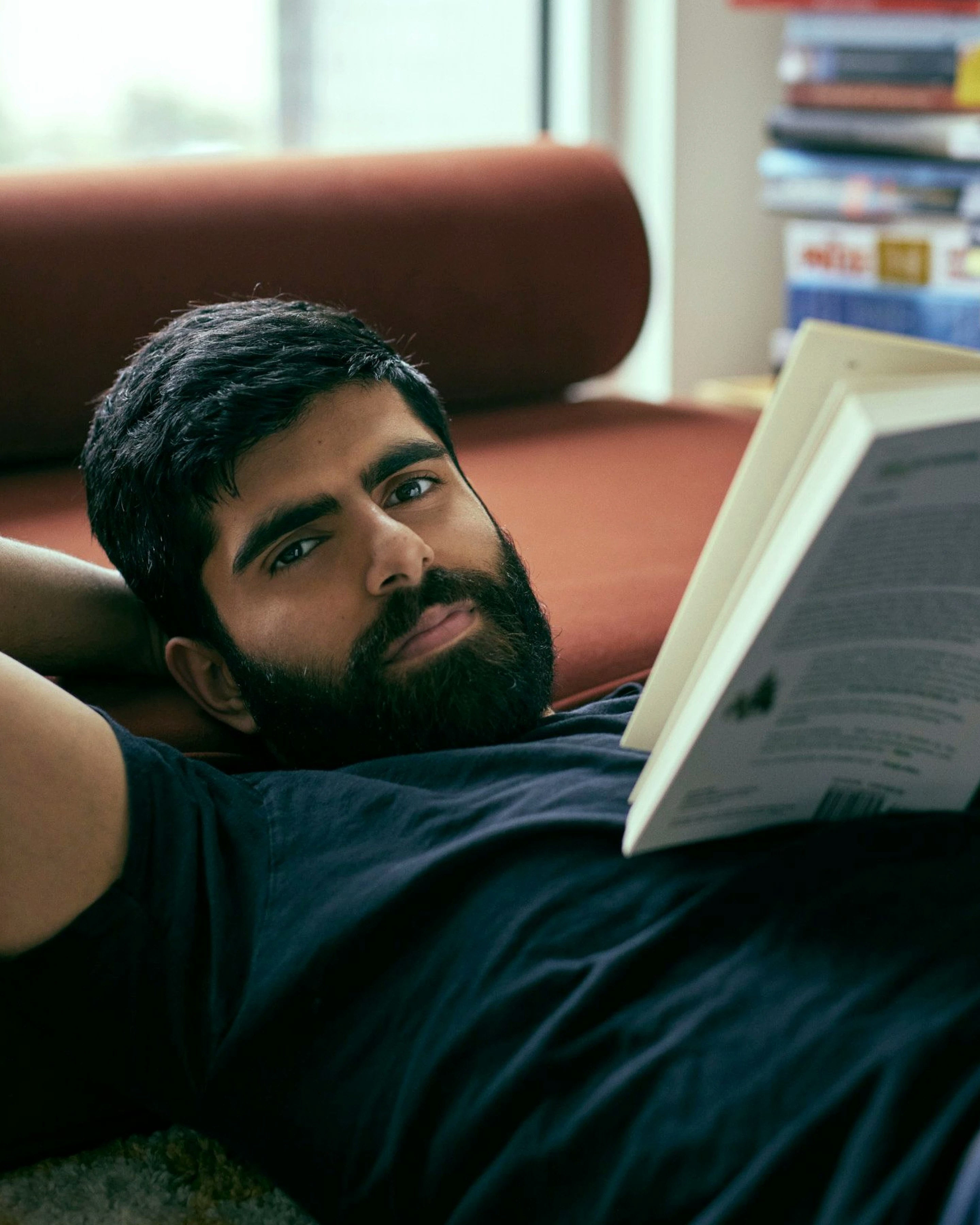 Photography of Dwarkesh Patel reading