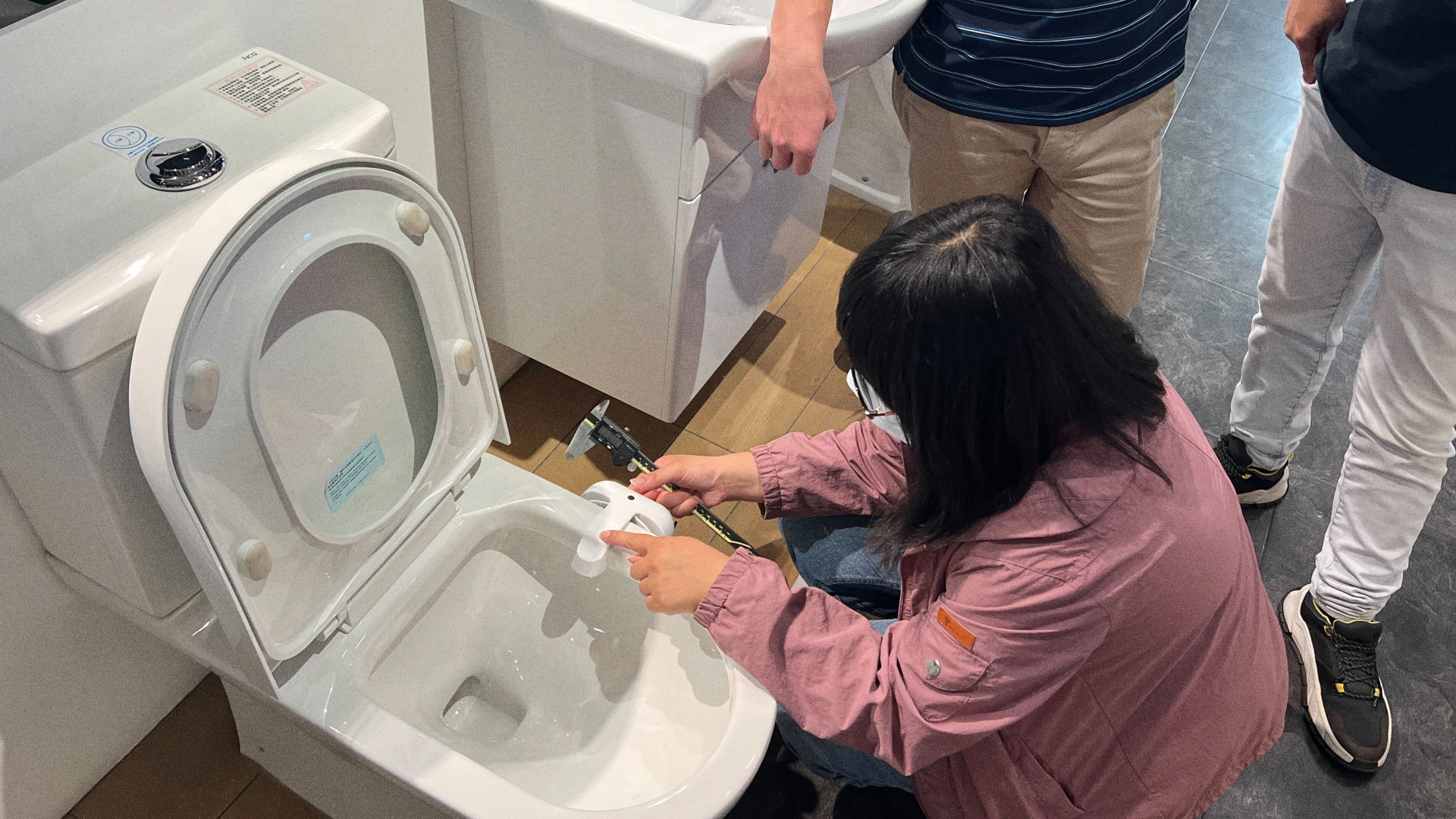 Installing device in toilet