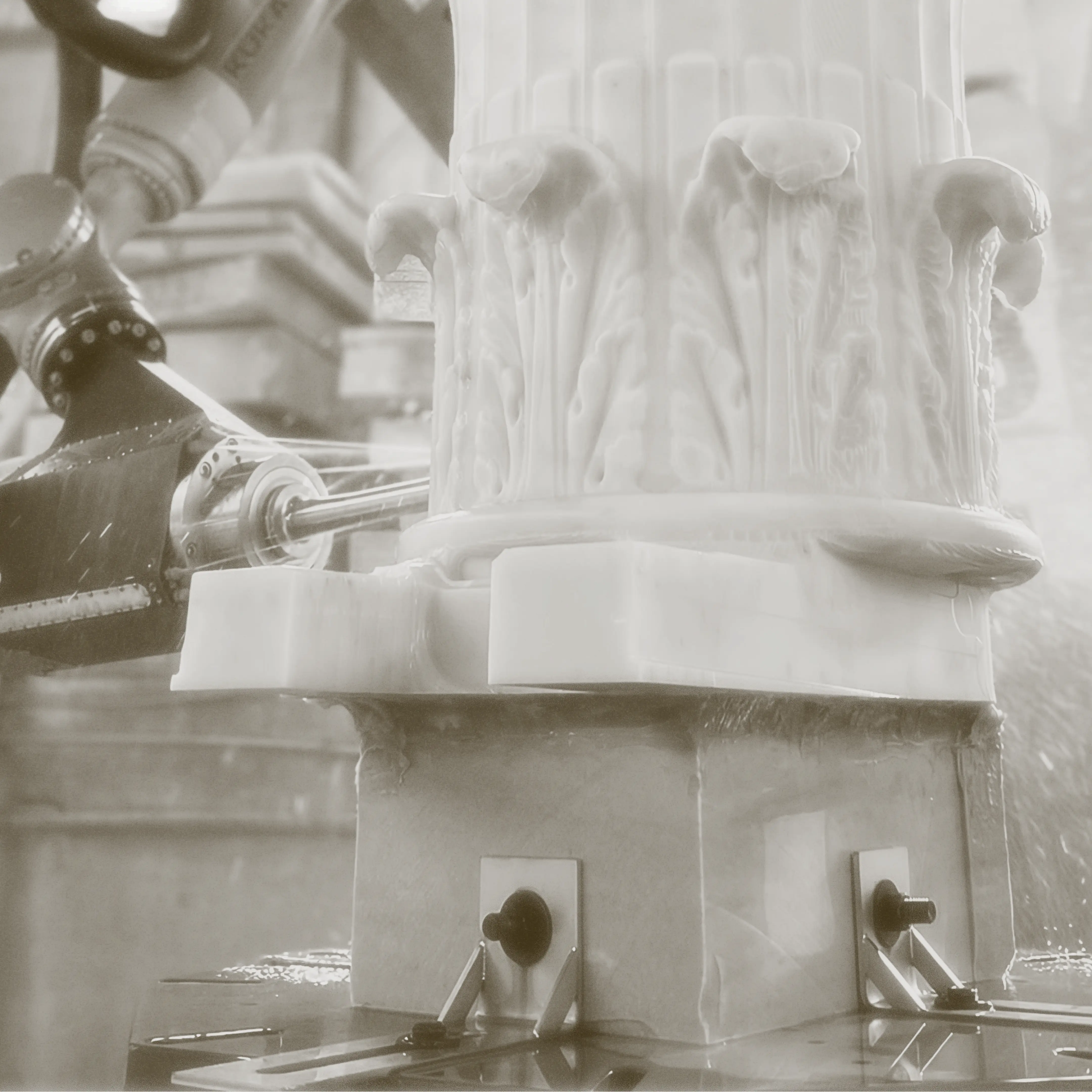 Photo from Monumental Labs of column being chiseled
