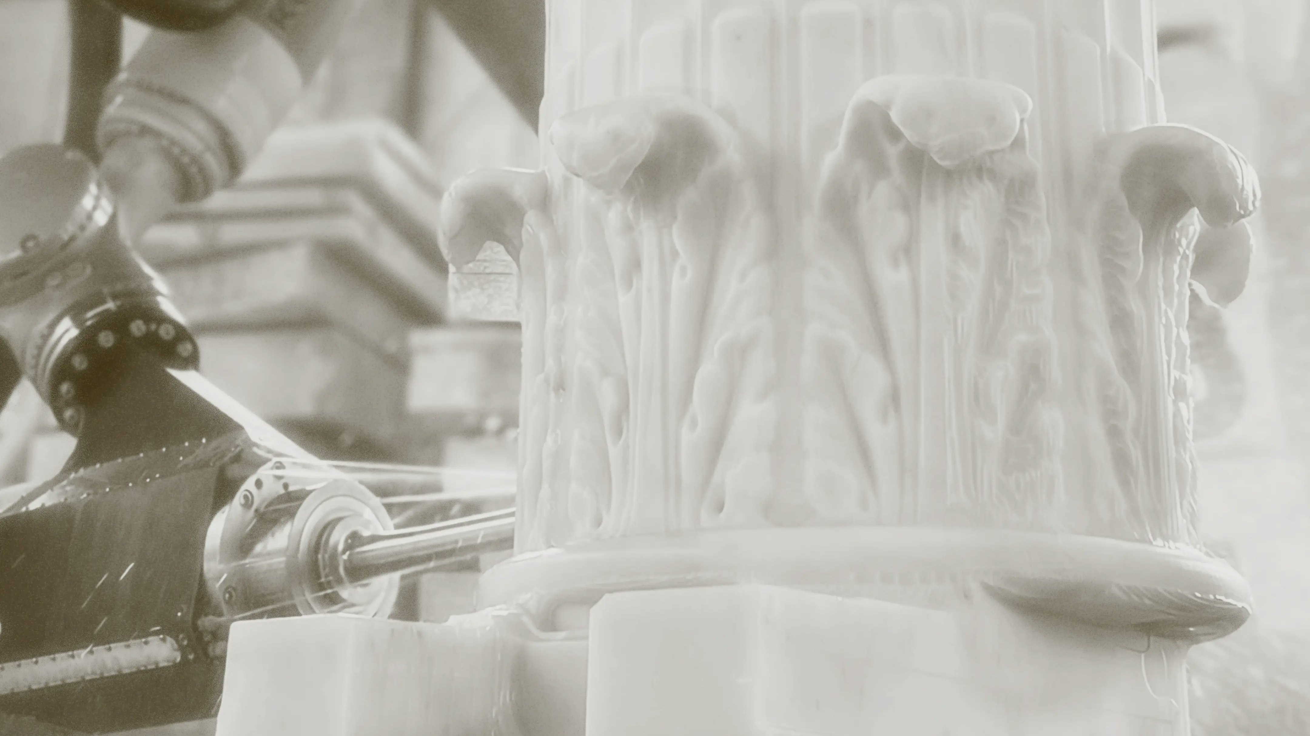 Photo from Monumental Labs of column being chiseled