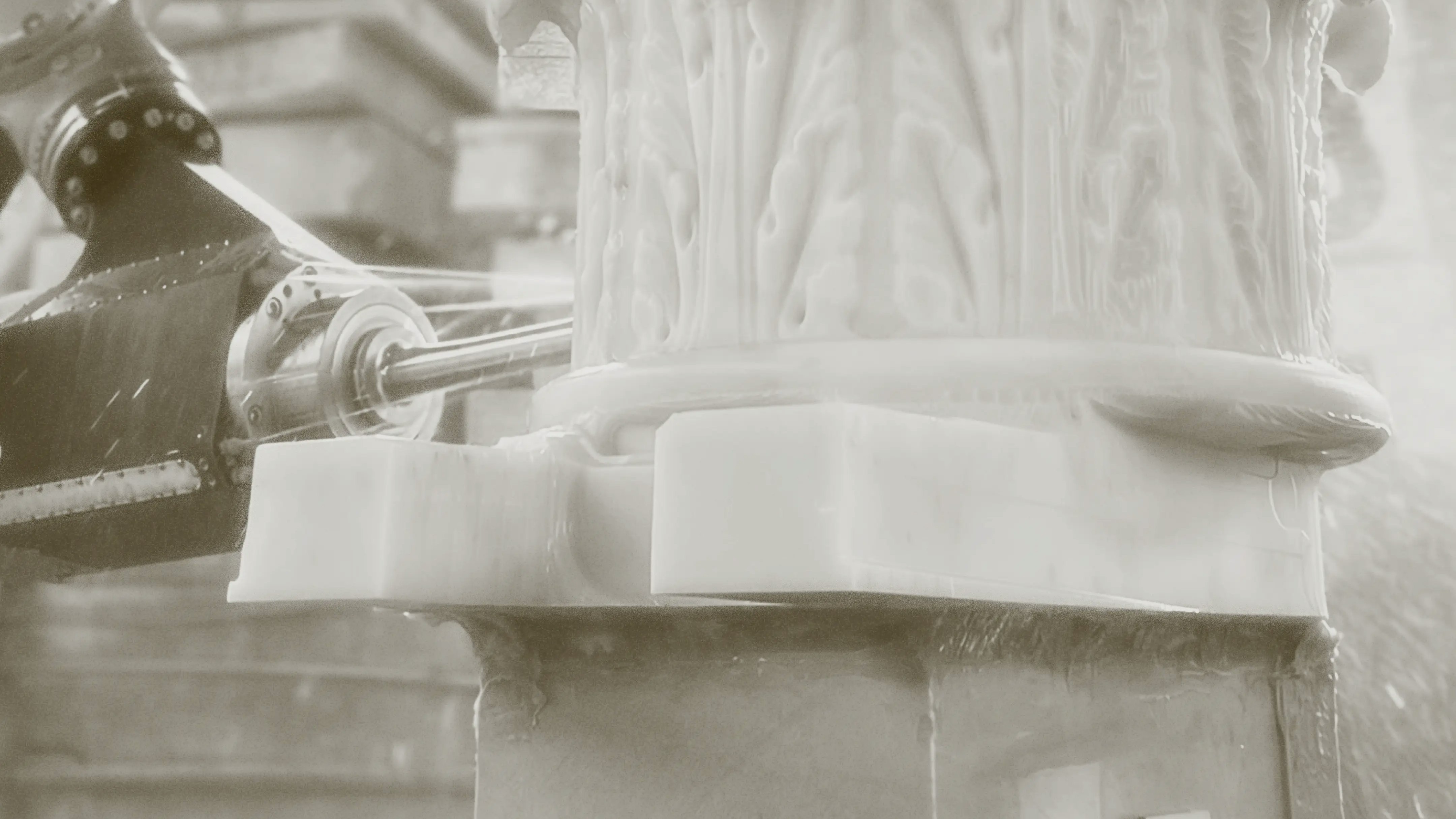 Photo from Monumental Labs of column being chiseled