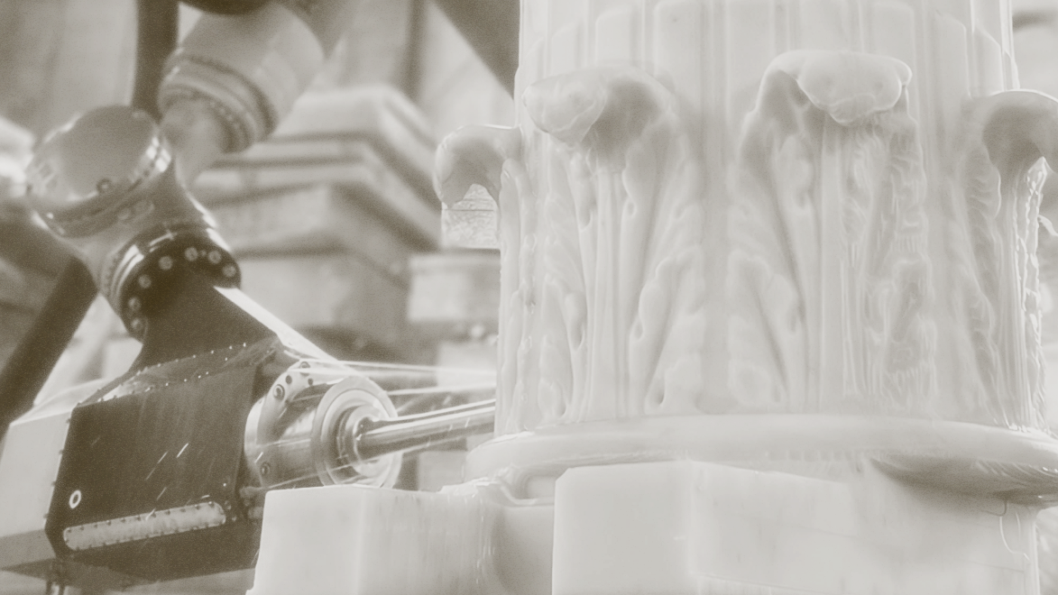 Photo from Monumental Labs of column being chiseled