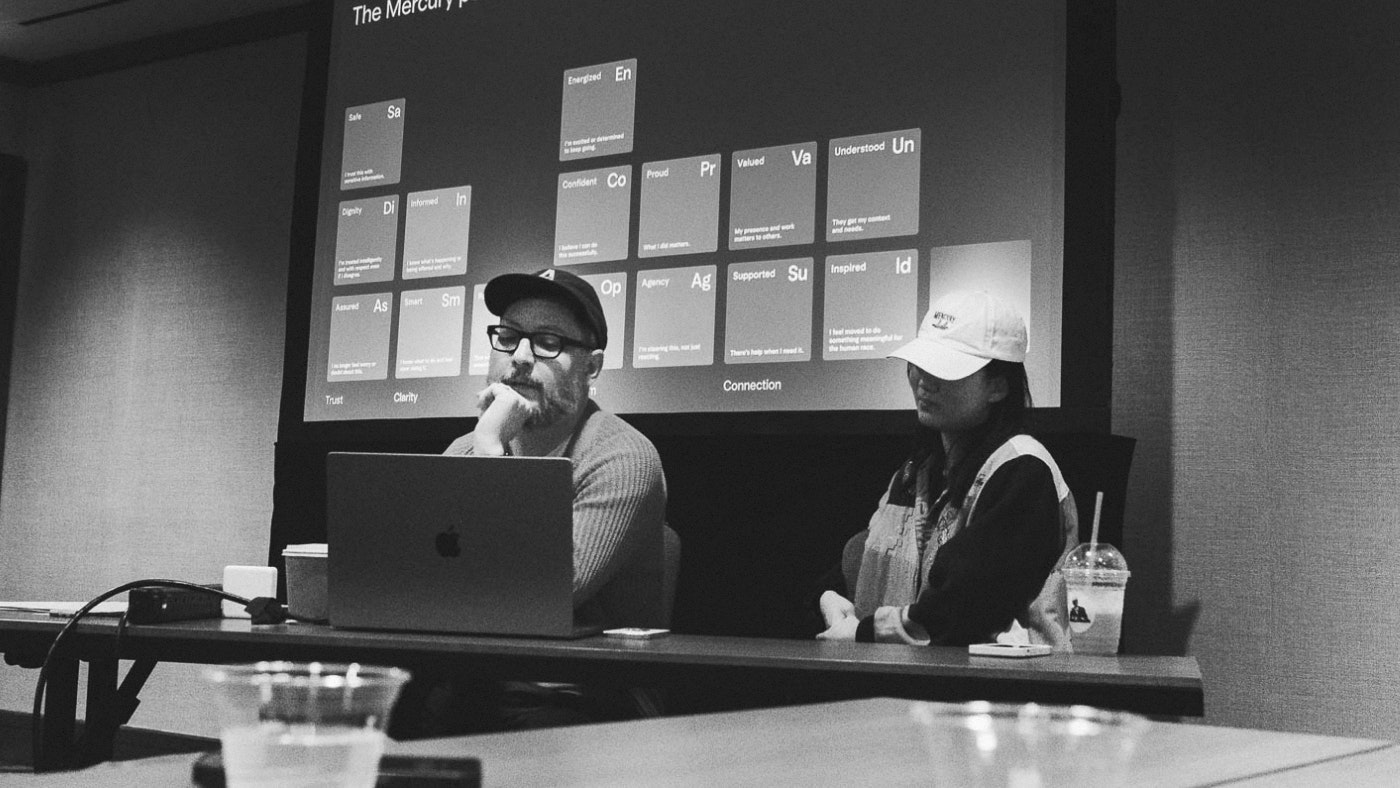 Sean and Wandi sharing the periodic table of emotions at the Design onsite in 2025