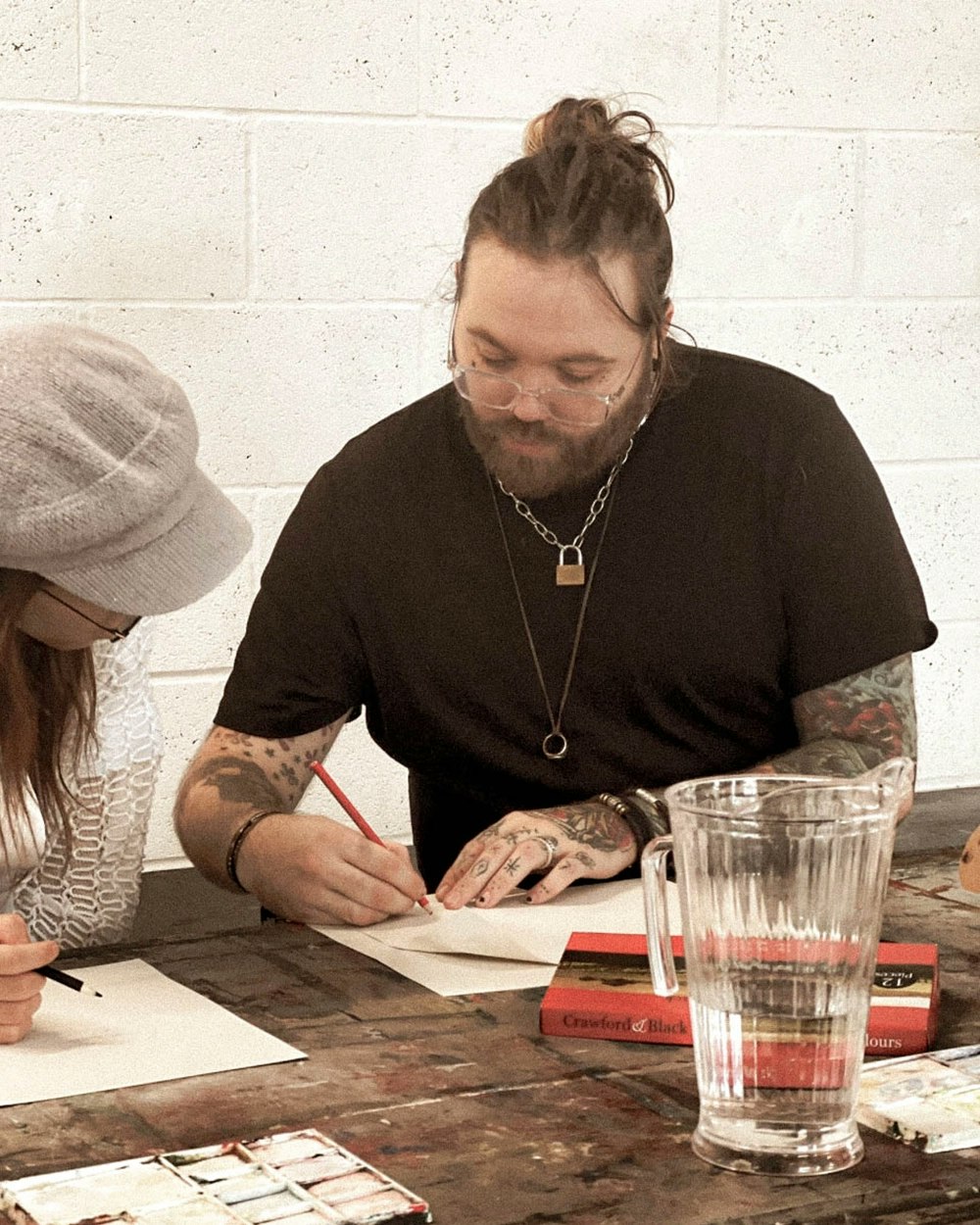 Colgrave at a table working