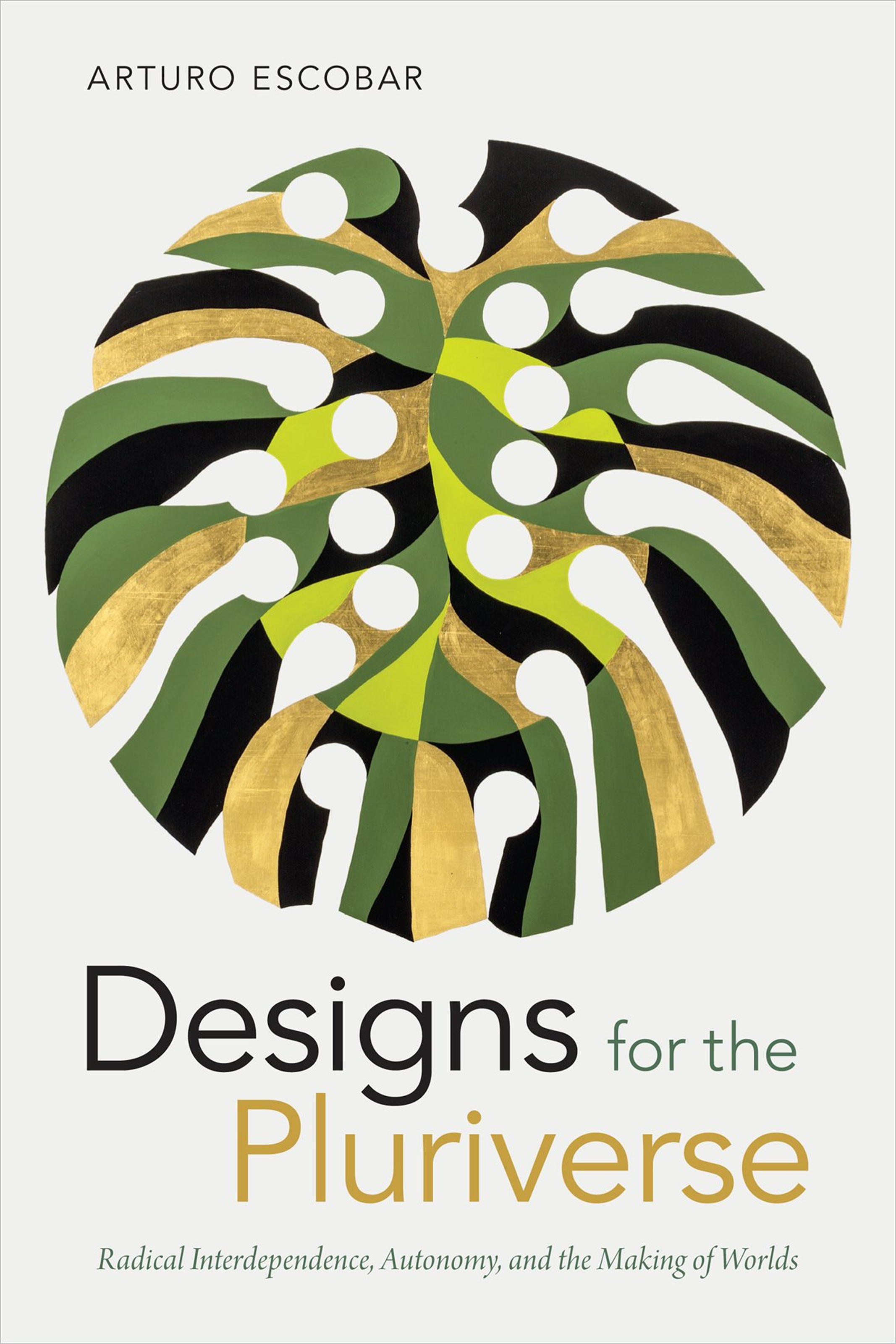 Cover of "Designs for the Pluriverse" featuring an abstract monstera leaf with circles cut into it.