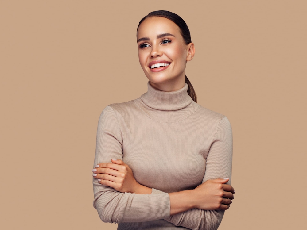 smiling with arms crossed