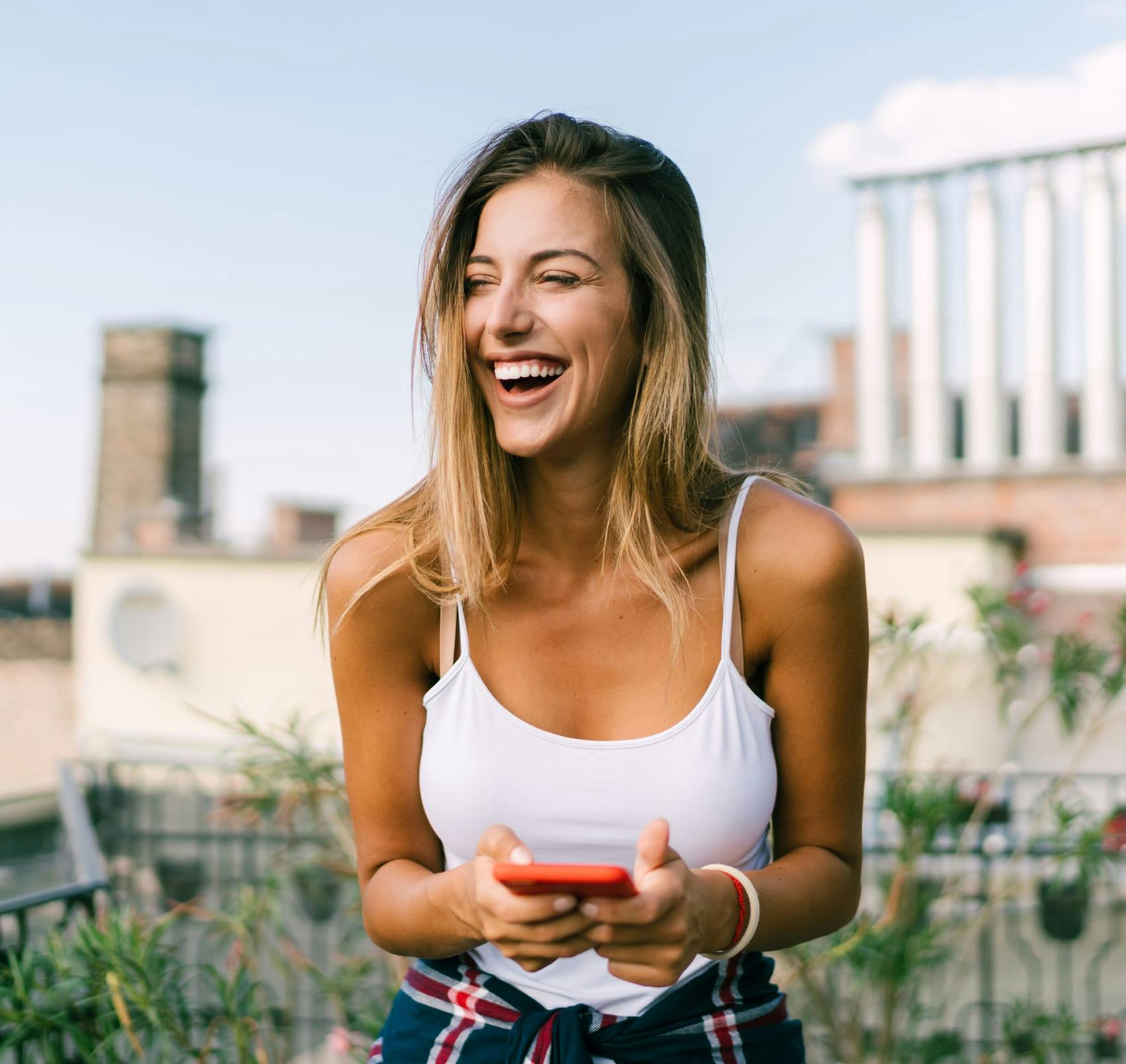 laughing on rooftop patio