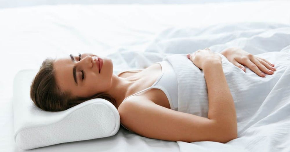 A woman in a comfortable position of sleep after her breast augmentation at Concierge Med Spa in Chicago, IL