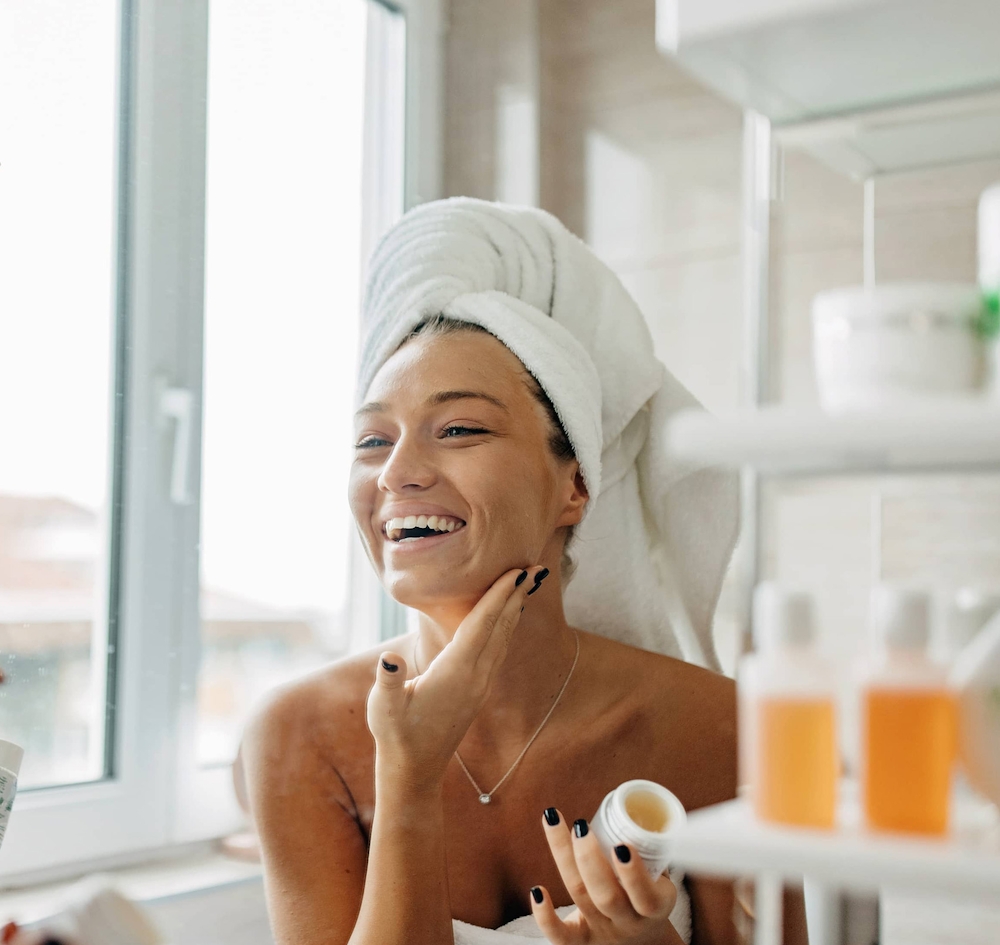 applying beauty product to face