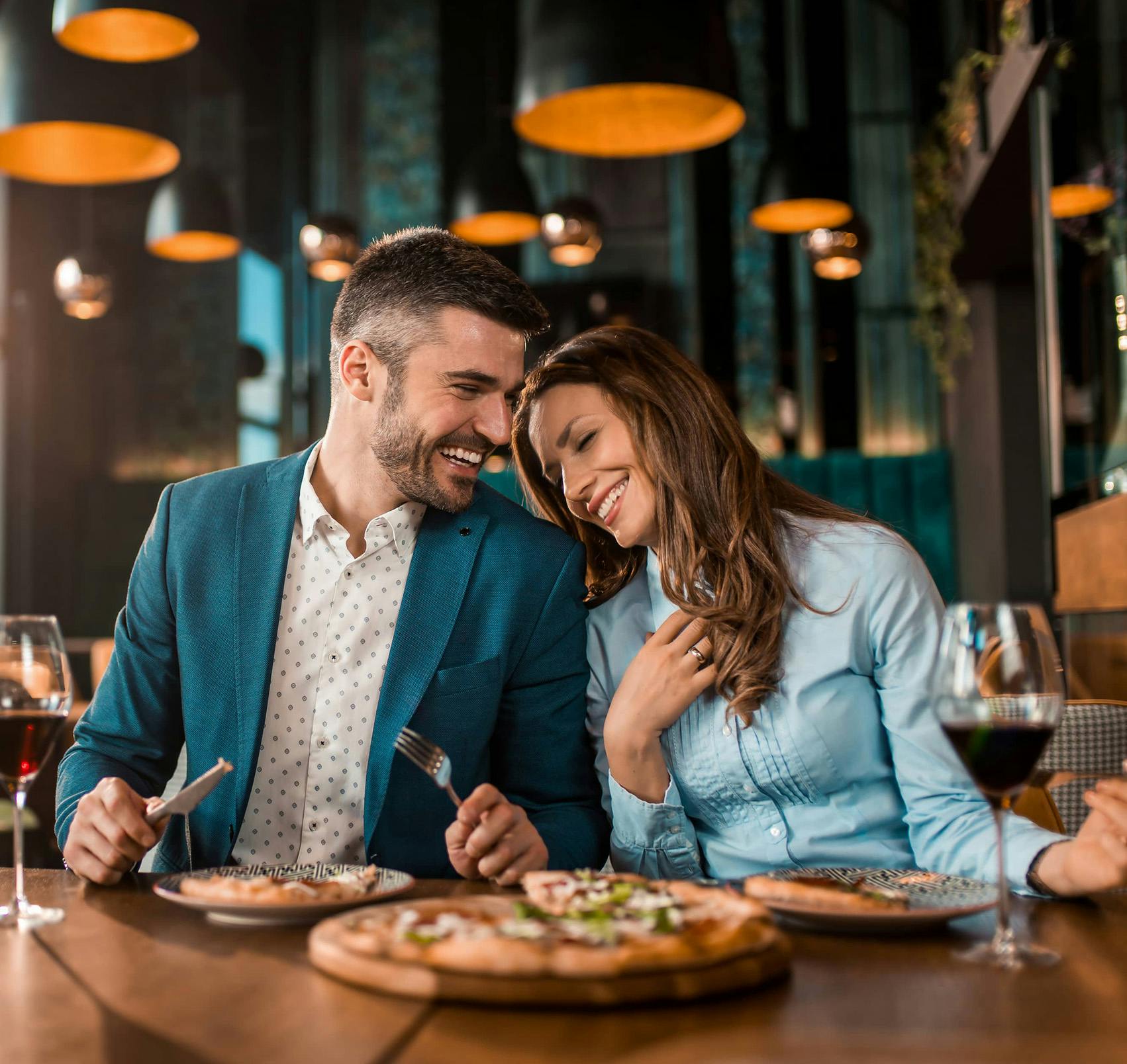 couple interacting at dinner
