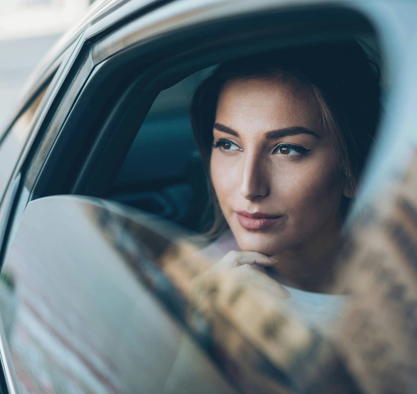 woman in car lookin gout the window