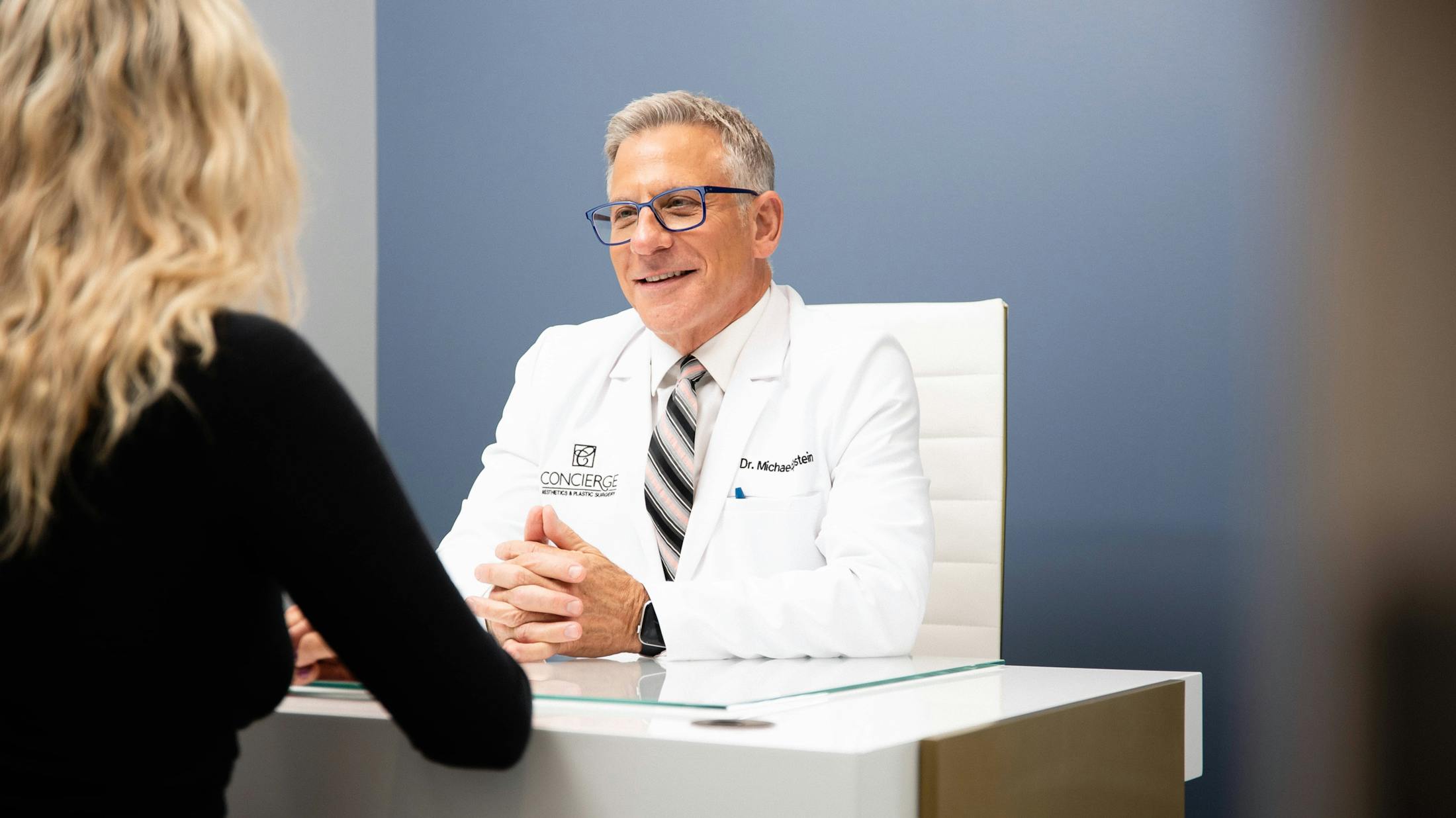 Dr. Epstein consulting a patient