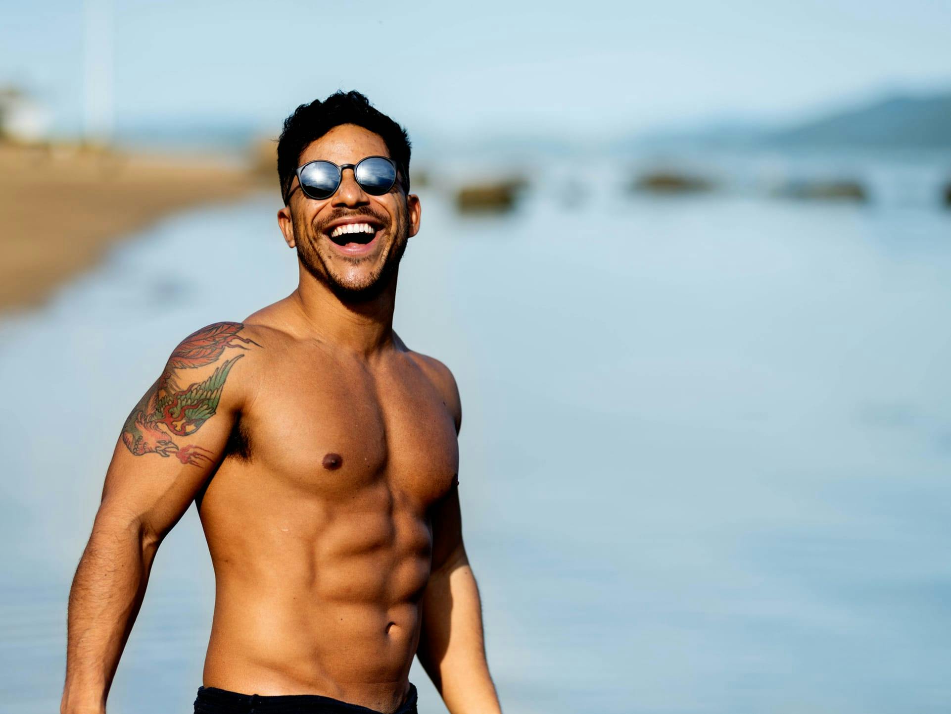 Shirtless man wearing sunglasses