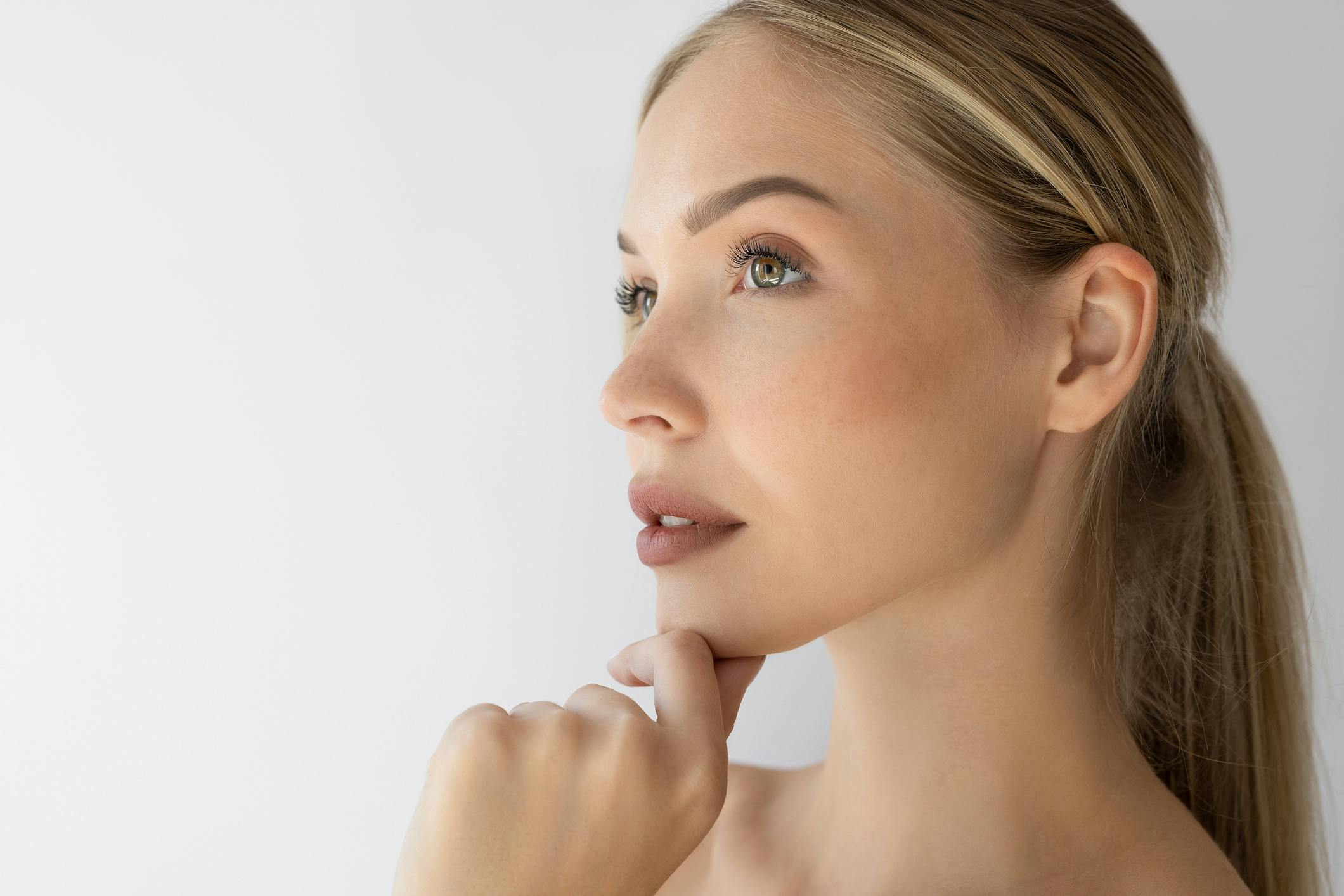 Woman touching her chin