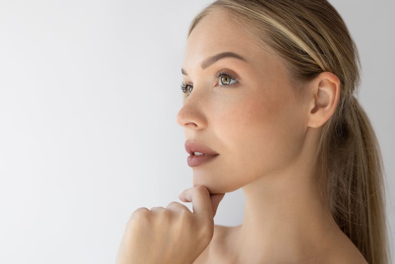 Woman touching her chin