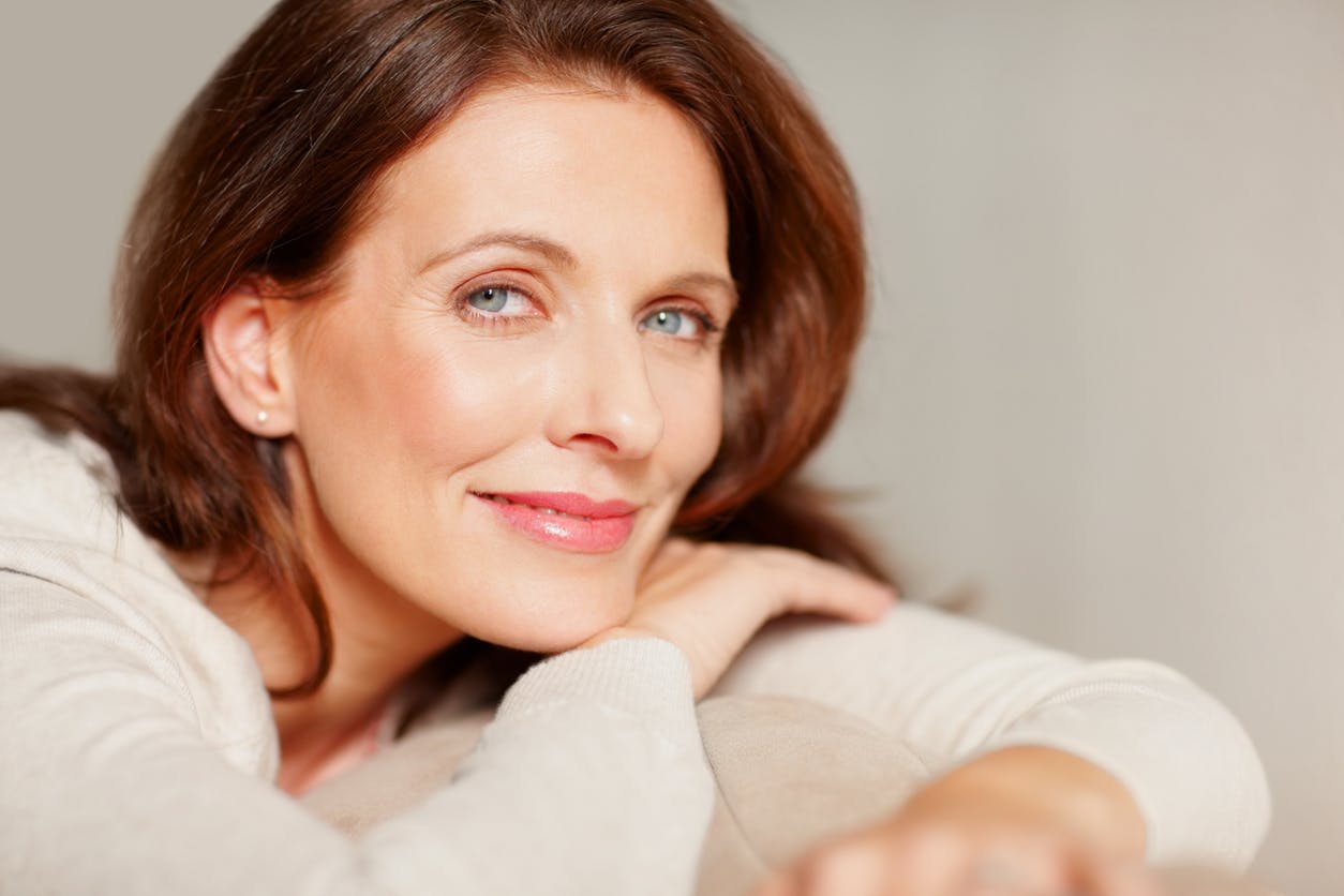 Woman wearing white cardigan