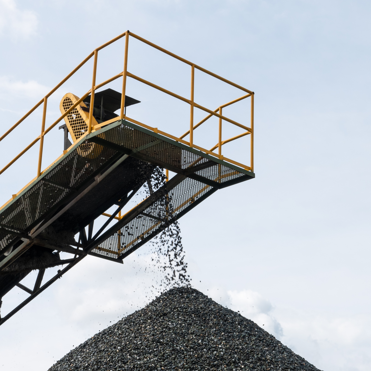 gravel being poured into a pile