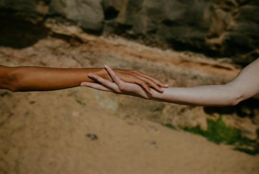 Two hands embracing