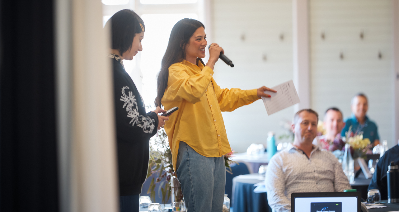 Woman at Future Group Retreat addressing staff