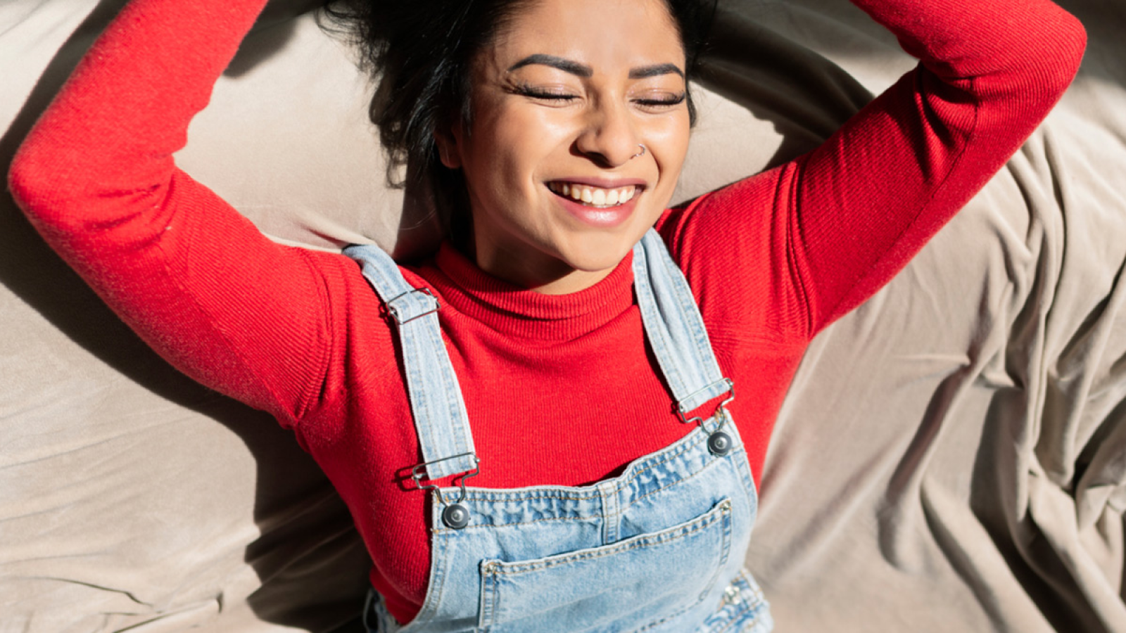 Woman in red jumper smiling