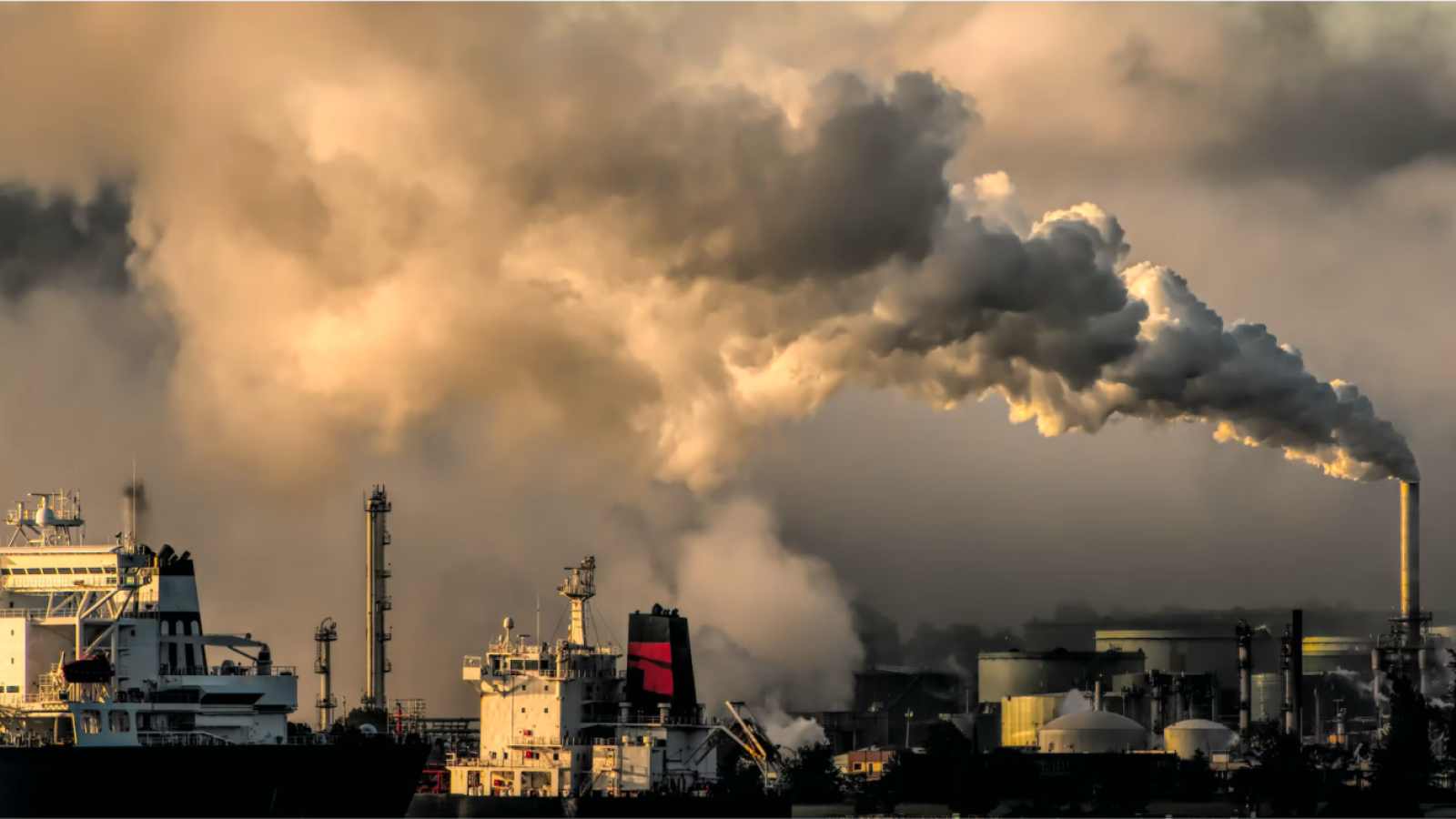 Factories with smoke billowing out of a smoke stack
