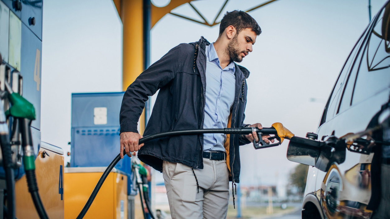 Person filling up car with petrol