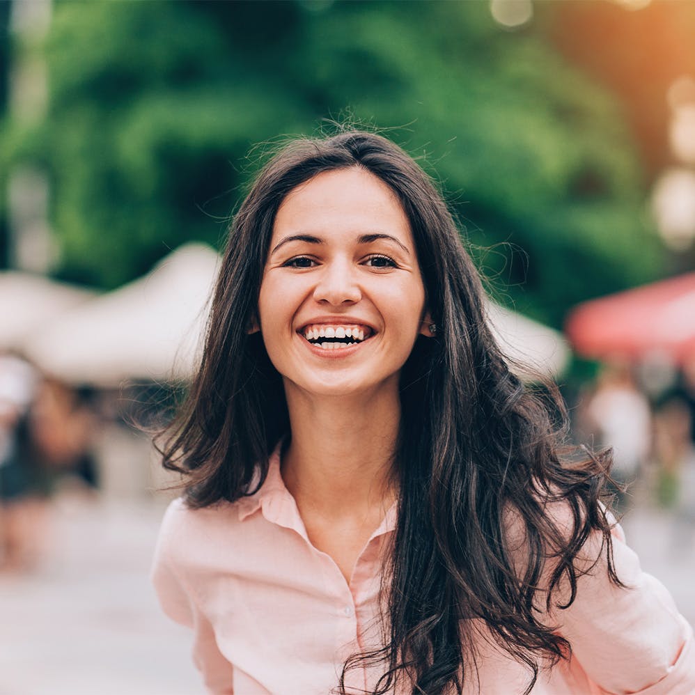 woman smiling at outdoor market