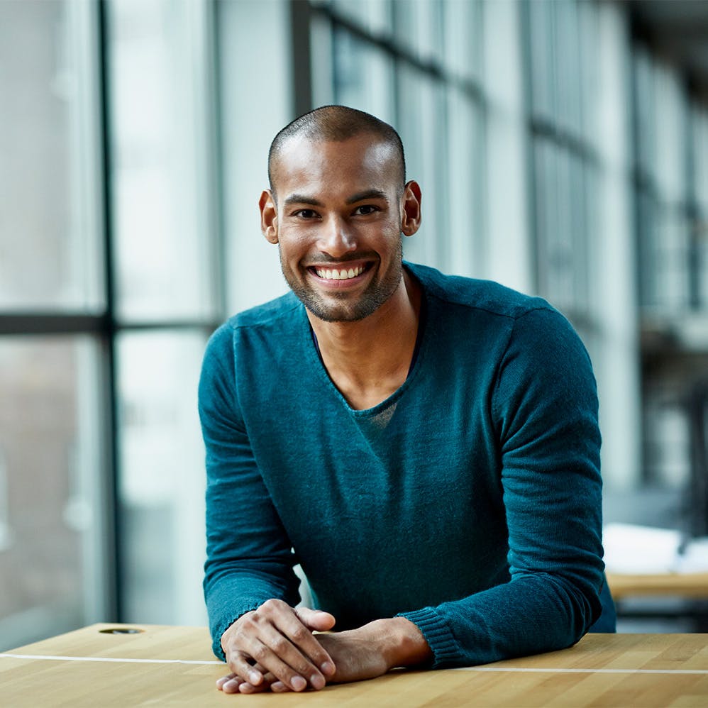 man sitting excitedly at table