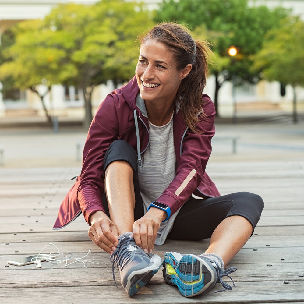 woman tying shoes