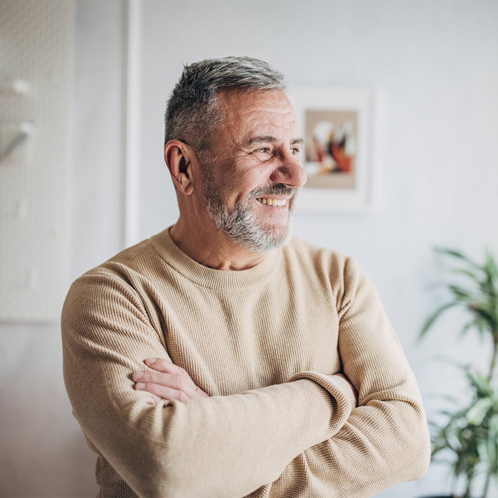 man standing with arms crossed