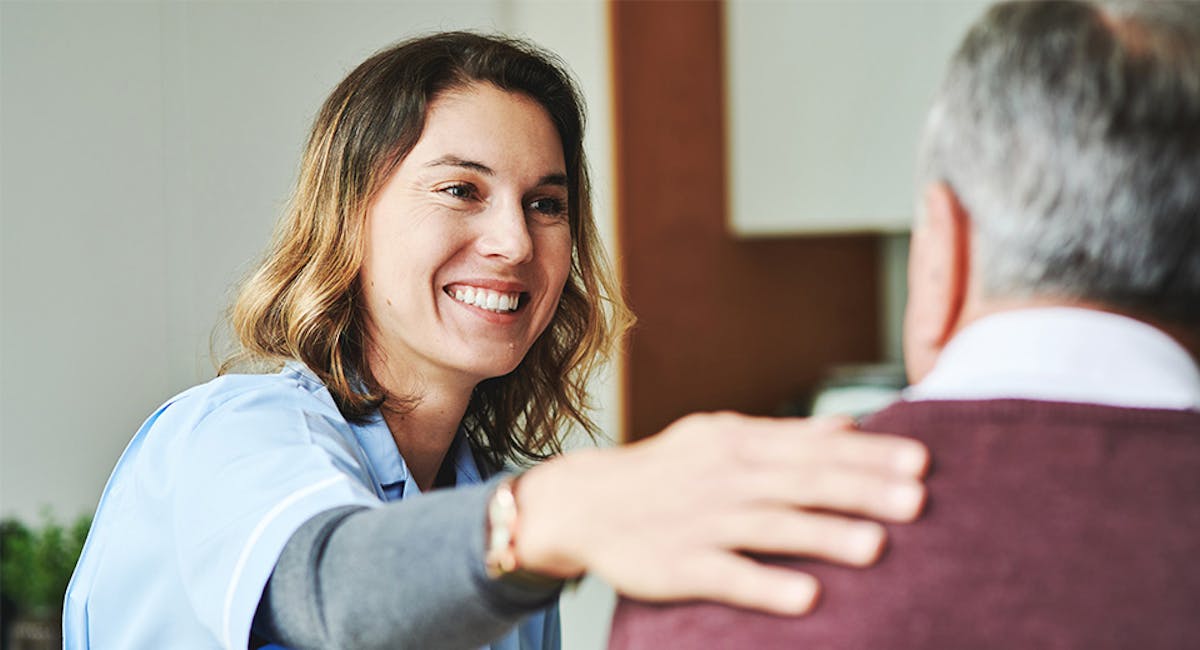 nurse helping patient